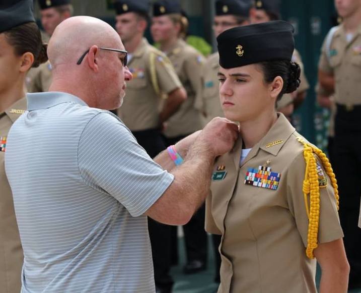 Jim Sass pins on the new rank to his niece cadet Erin Sass during the Nease NJROTC winter Promotions & Awards ceremony.