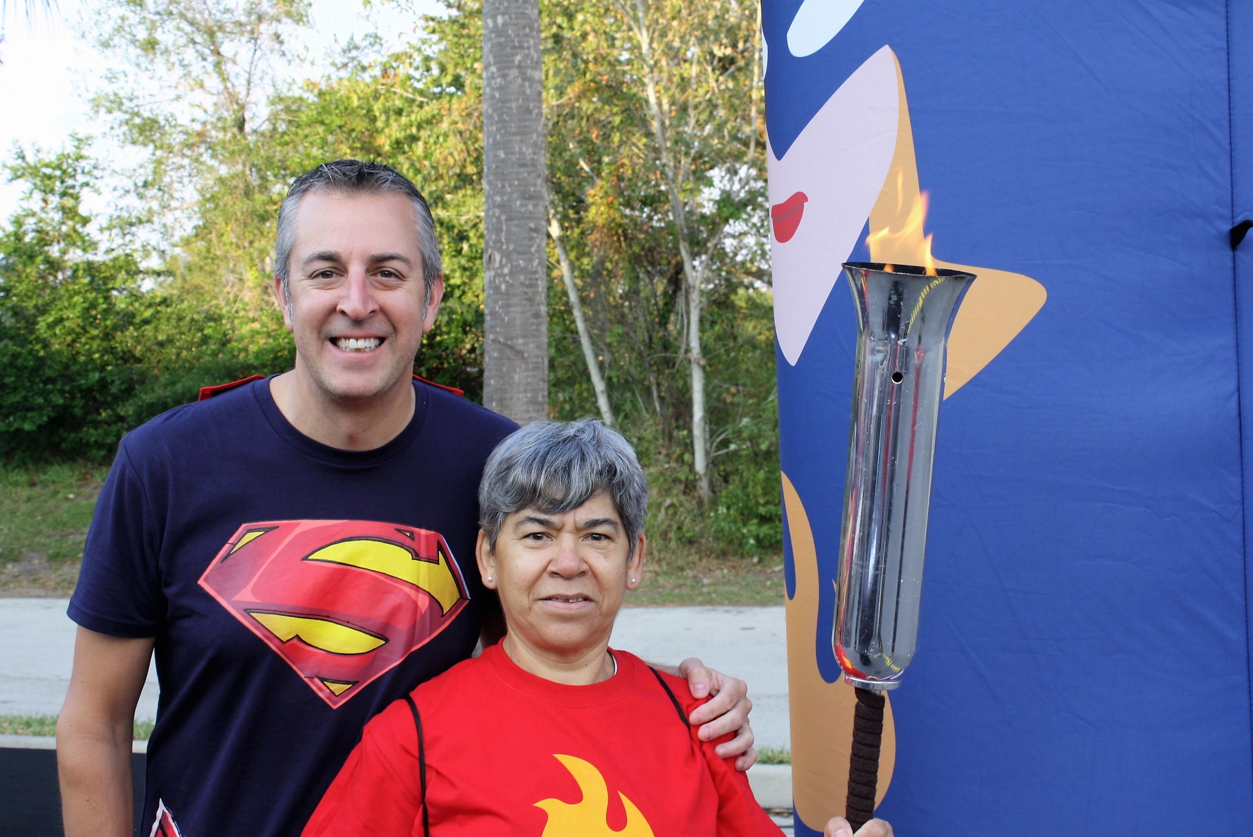 Sawgrass Marriott General Manager Todd Hickey and torch bearer Elizabeth Zuniga prepare to participate in the Torch Relay for Children’s Miracle Network Hospitals. The Sawgrass Marriott in Ponte Vedra hosted the Jacksonville stop on the national torch relay fundraising event. Participants dressed as superheroes in recognition of the relay's "Everyday Heroes" theme.