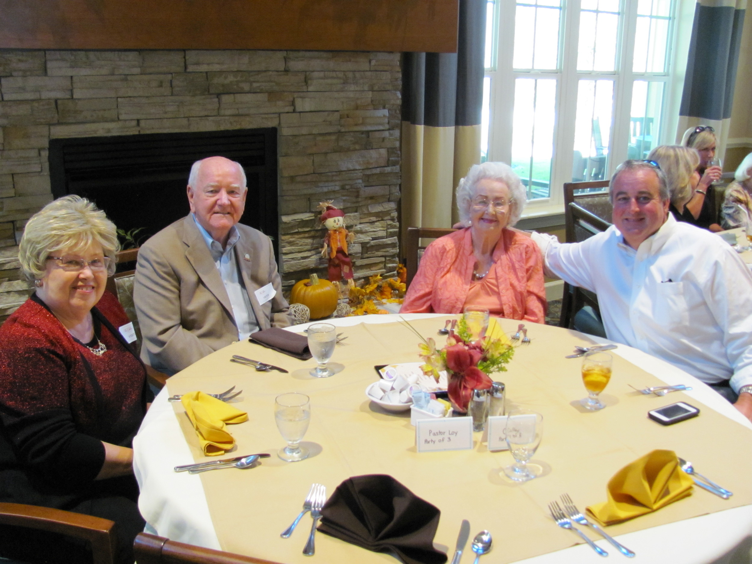 (From left to right): Anita Loy, Pastor Bob Loy, Gloria Caffey and Matty Caffey enjoy the Thanksgiving luncheon