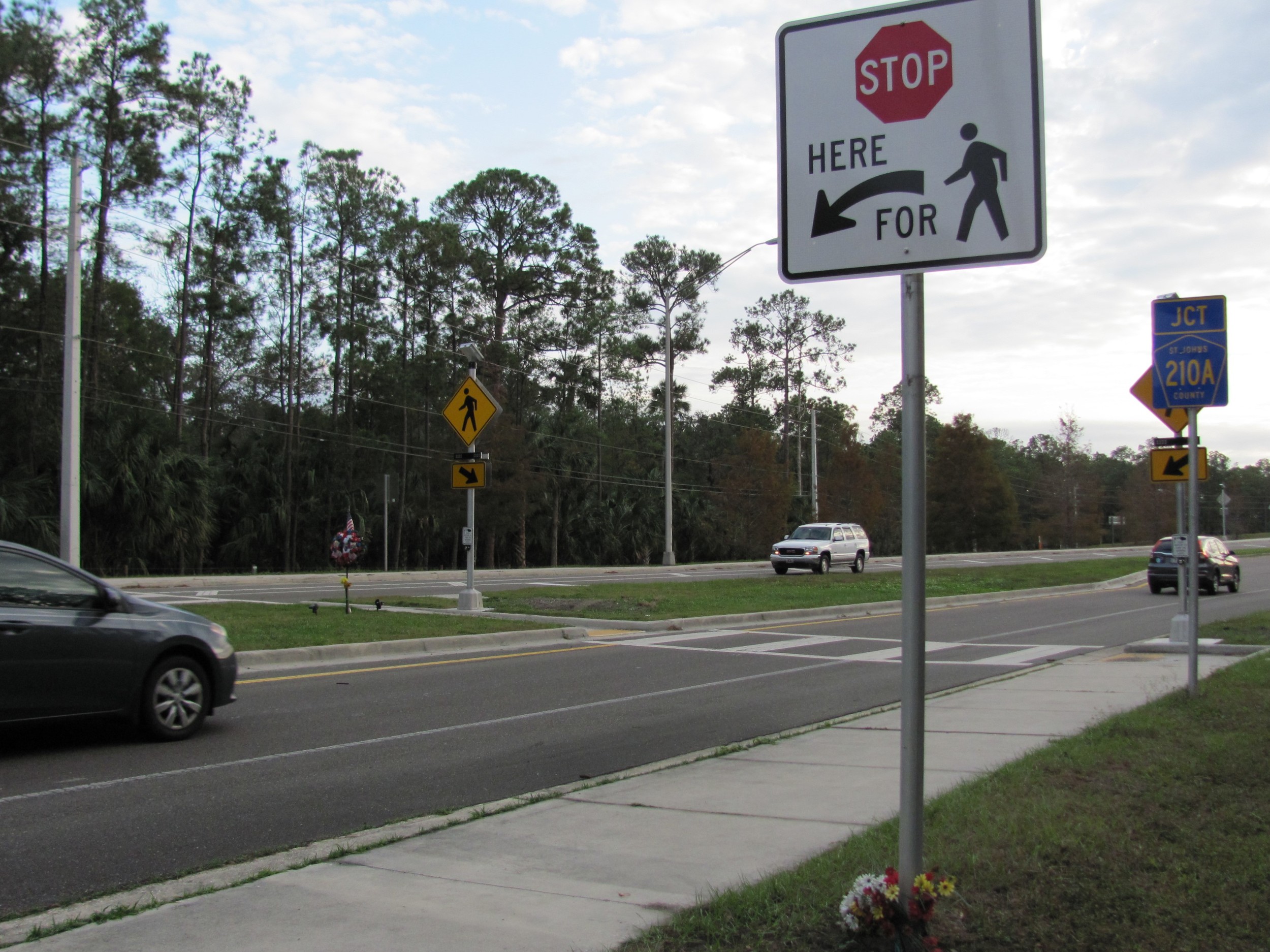 St. Johns County officials say the death of a 17-year-old Nease high school student in July influenced the county to implement the new flashing signals at the foot of the Palm Valley Bridge.