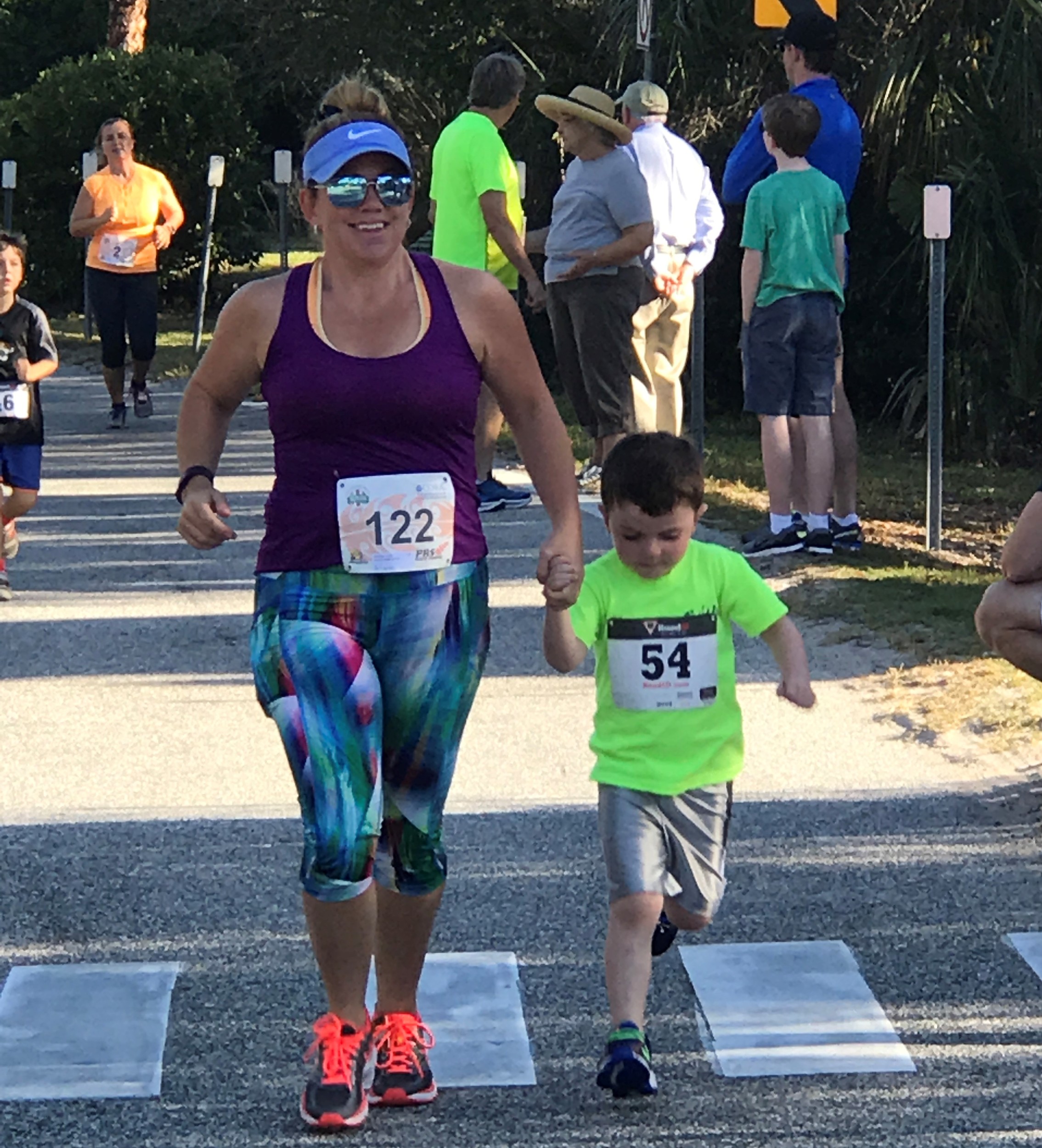 Amanda and Lucas Relihan speed toward the 1K finish line at the Ponte Vedra YMCA’s 10th annual Turkey Trot on Thanksgiving morning.