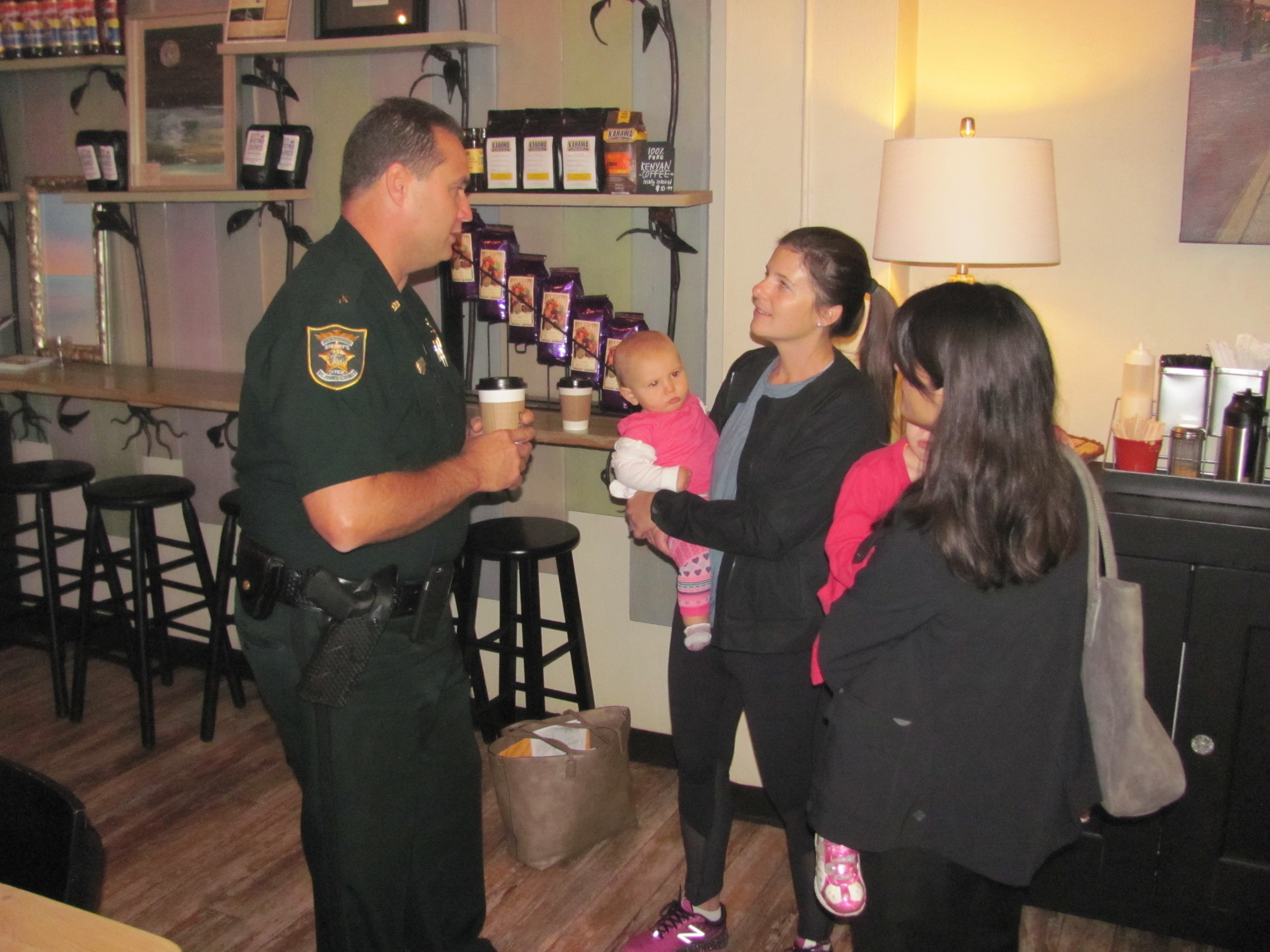 Commander Scott Beaver from the St. Johns County Sheriff’s Office speaks with a group of residents at Coffee with a Cop.