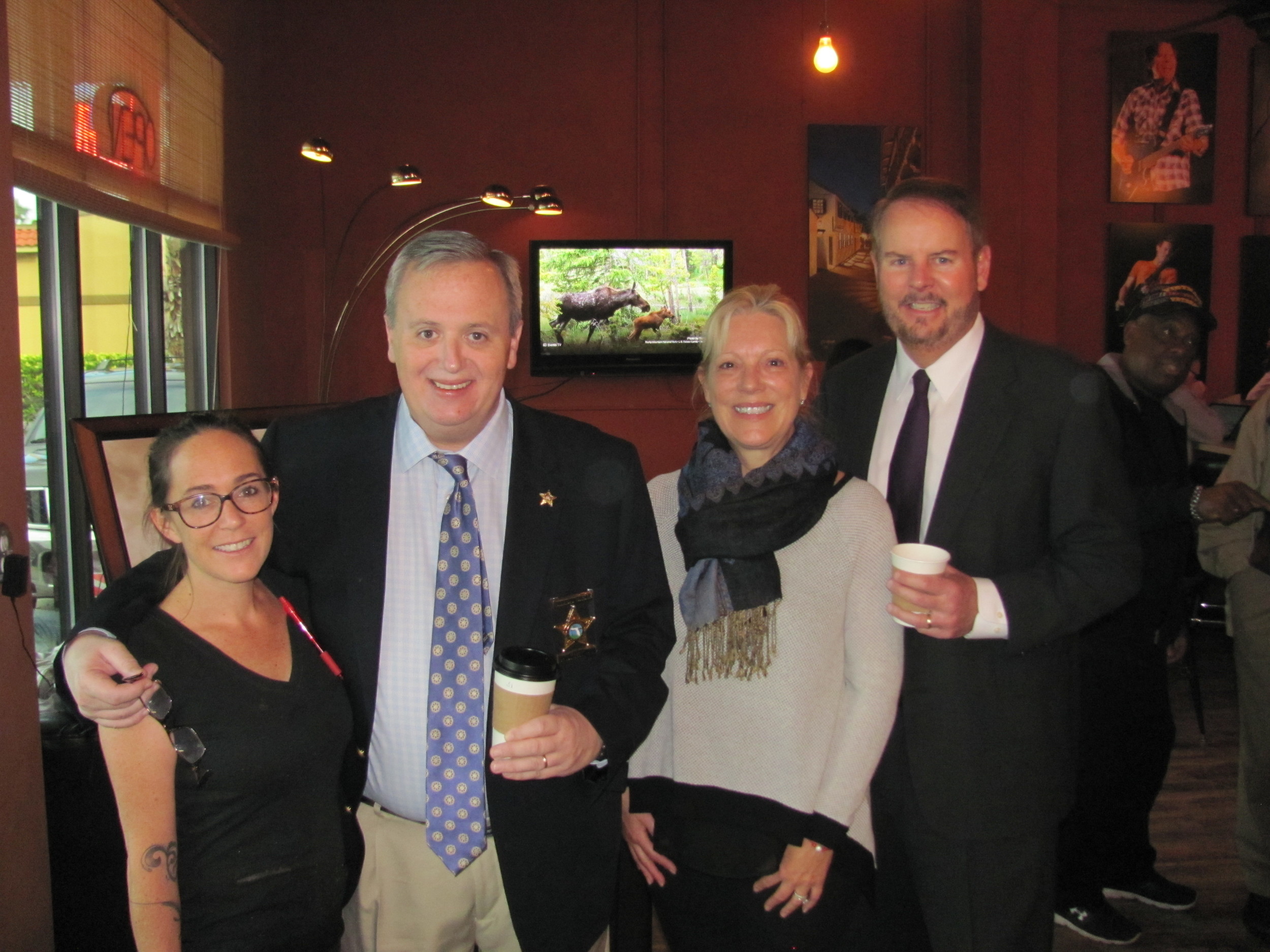 St. Johns County Sheriff David Shoar and County Administrator Michael Wanchick with City Bistro Tea House & Coffee Company Owners Tash Olivera and Robyn Mooney.