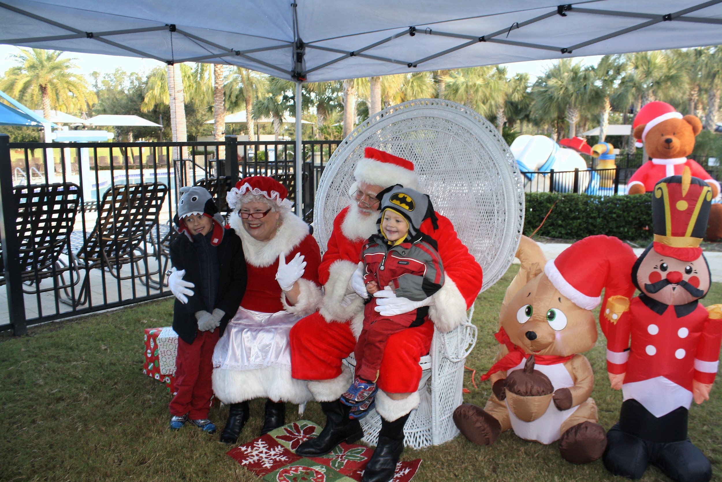 Benjamin and Nicholas Coltvet of Nocatee’s Willowcove neighborhood visit with Santa and Mrs. Claus.