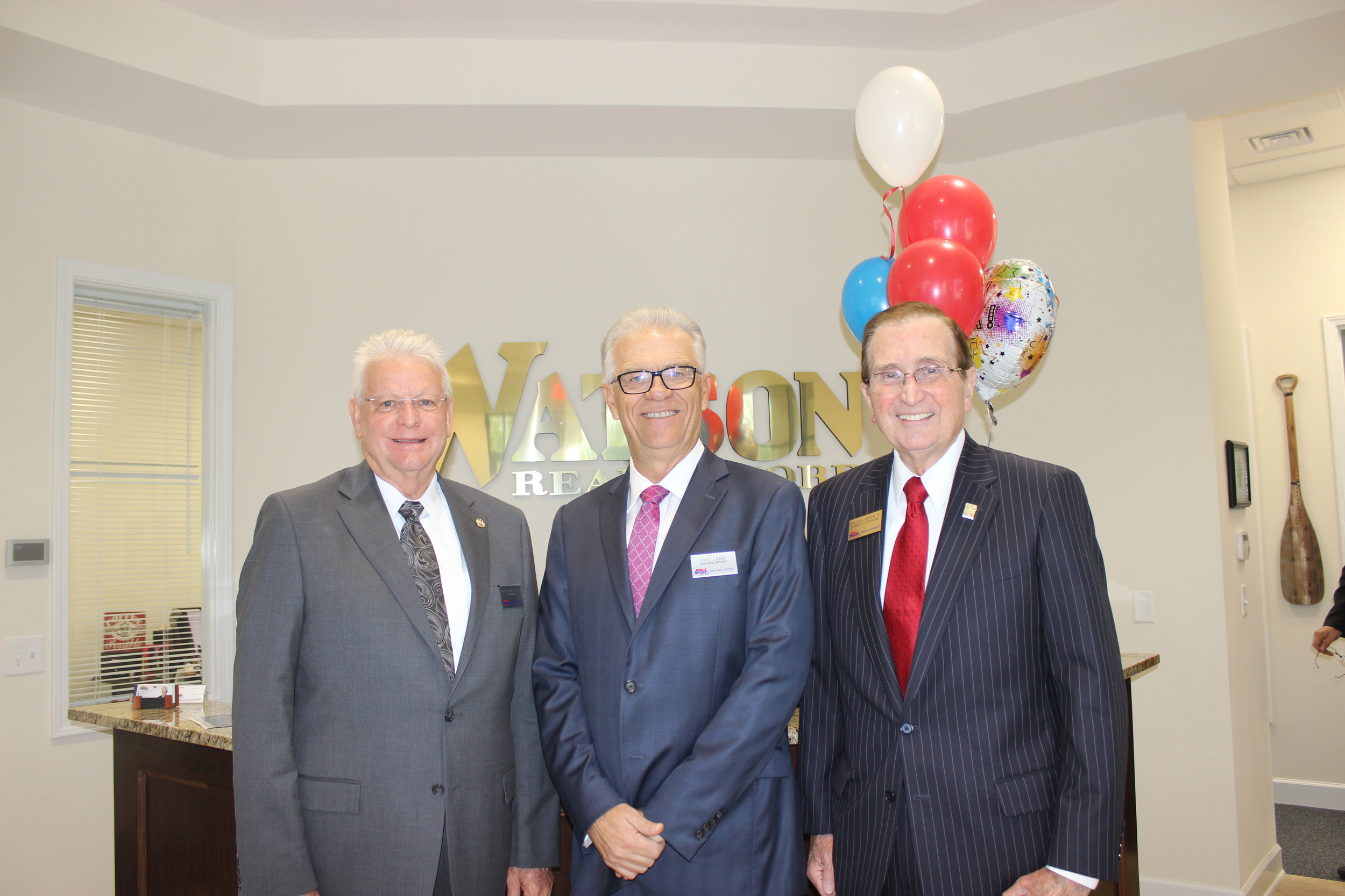 Watson President Ed Forman, Nocatee Office Managing Broker Phil Lamb and company Founder and Board Chair William Watson Jr.
