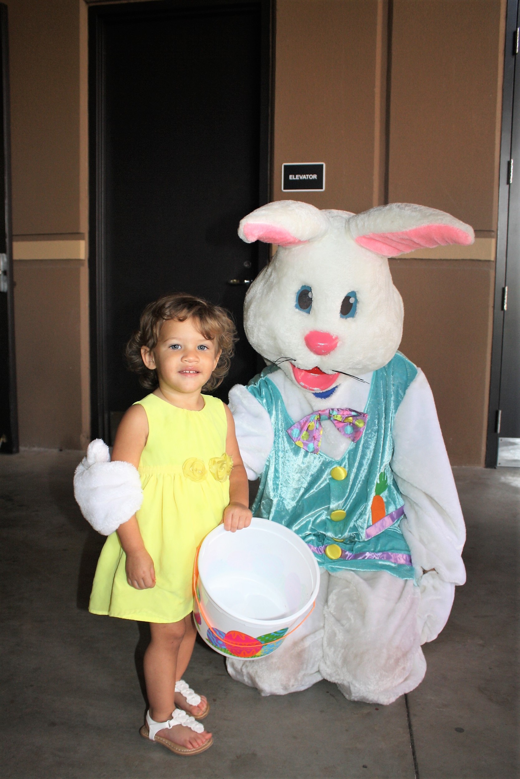 Ella Davis, 18 months, meets the Easter Bunny at Crosswater Community Church's Easter egg hunt.