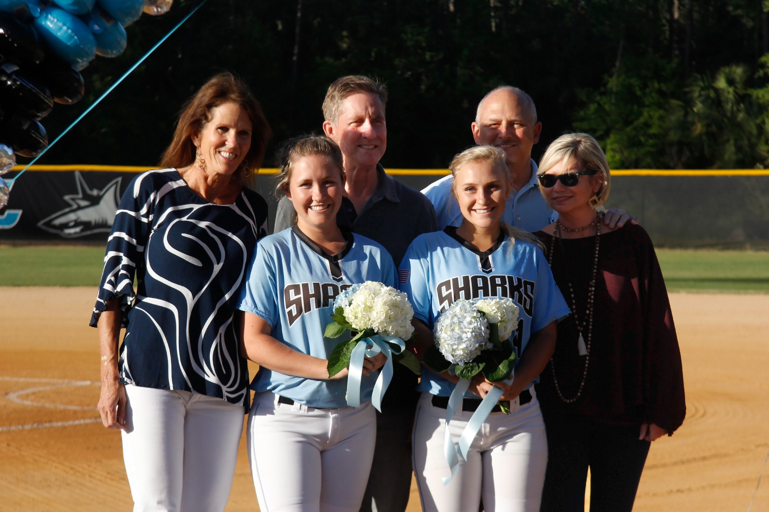 Farley Callaghan (left) and Taylor Bradshaw and their parents were honored at the Senior Night ceremony before the game against Pedro Menendez.