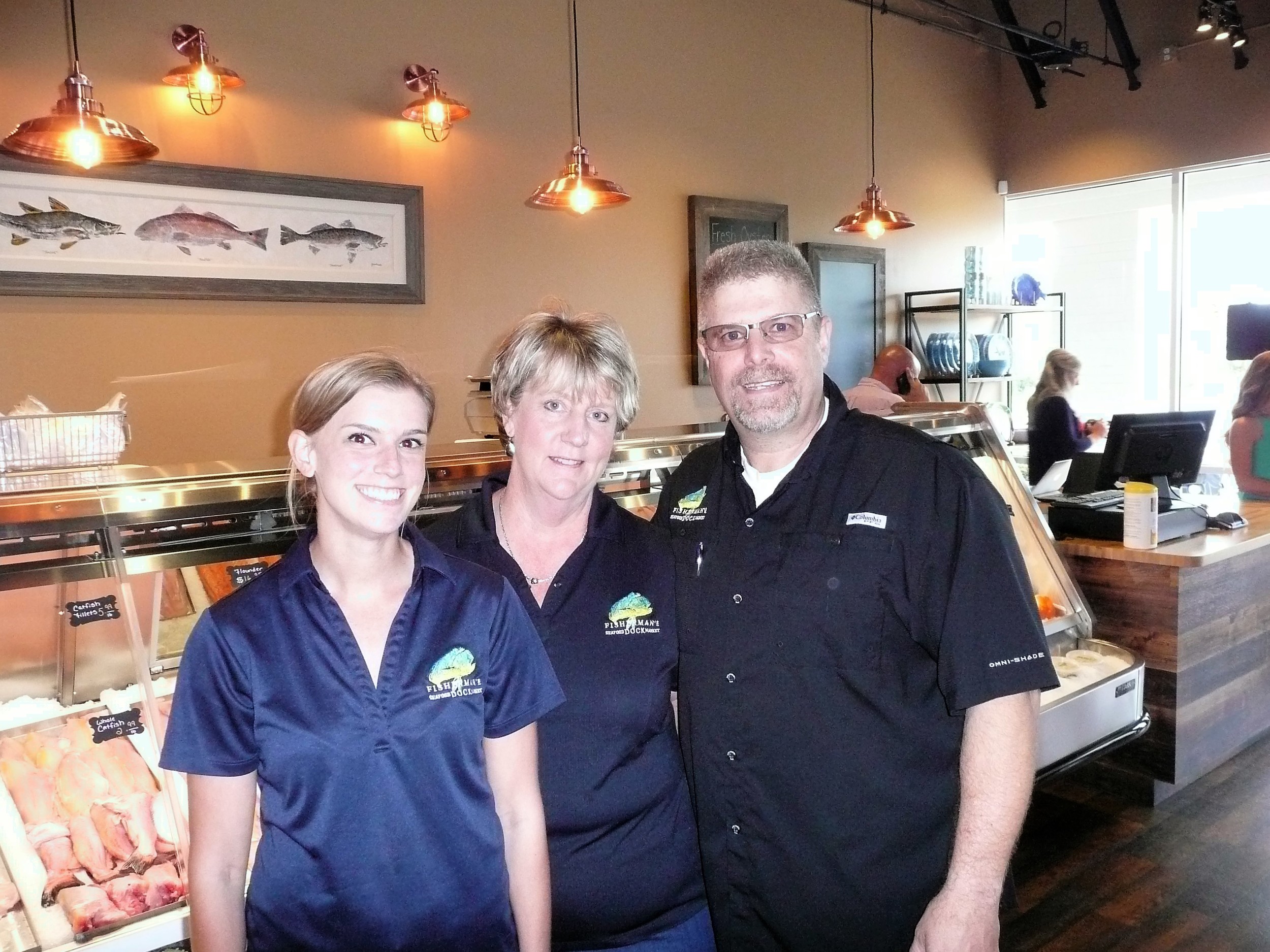 Store Manager Andrea Kurtzke with Jennifer and Rich Rautio