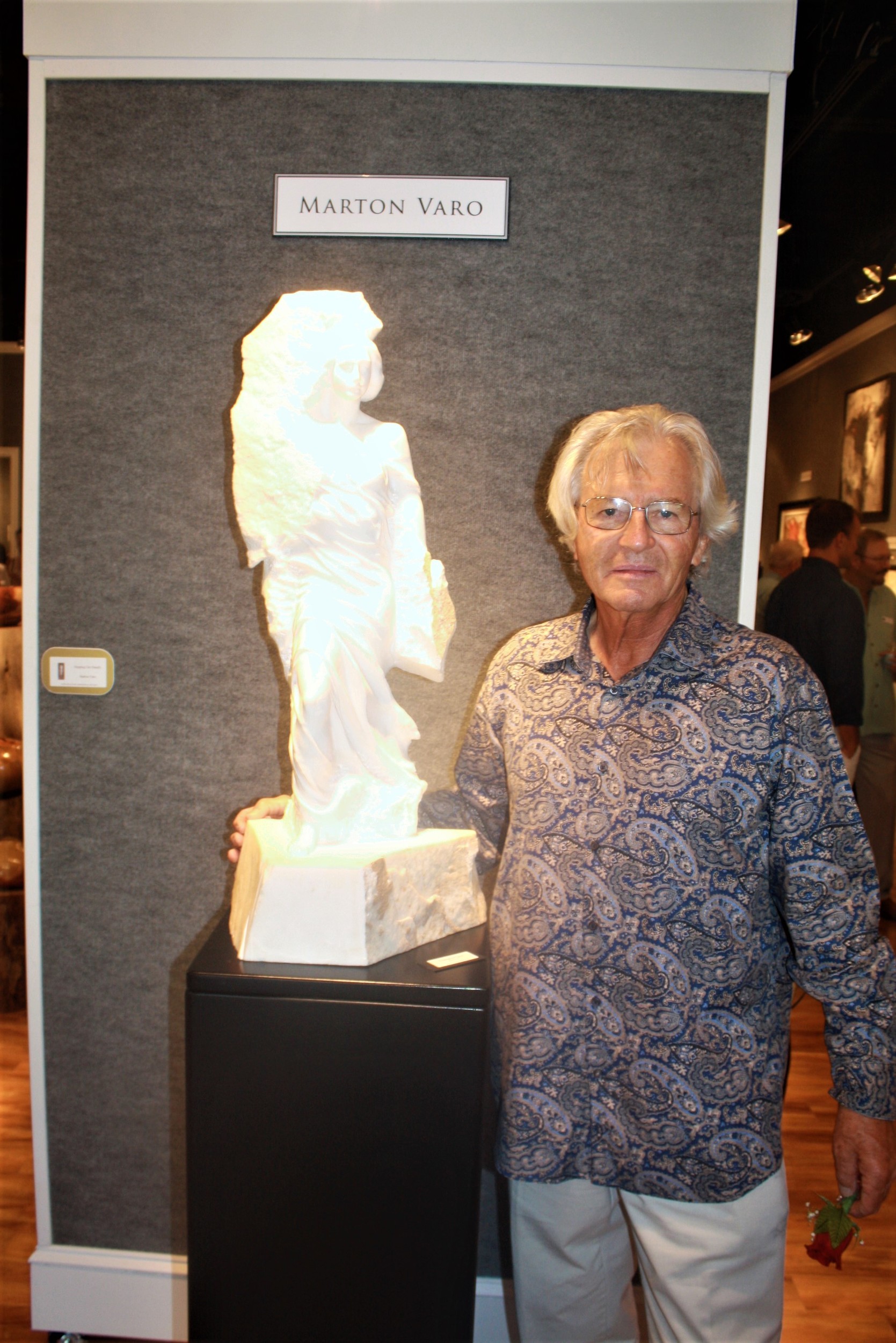 Sculptor Marton Varo displays one of his works at Cutter & Cutter
