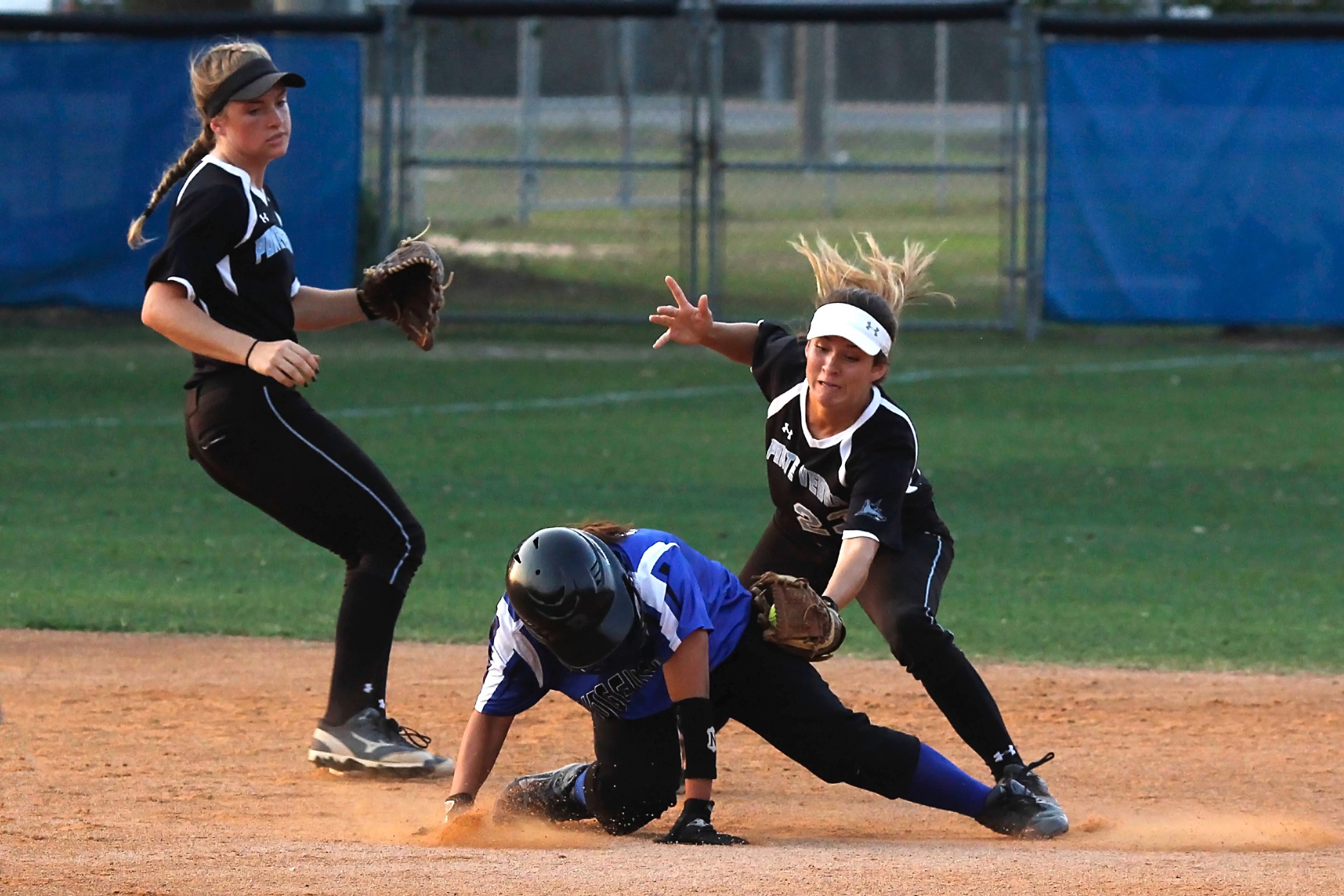 Ponte Vedra’s second baseman Kiley Hennessey puts the tag on the Ridgeview base runner to complete a pickoff from Sharks’ catcher Taylor Bradshaw.