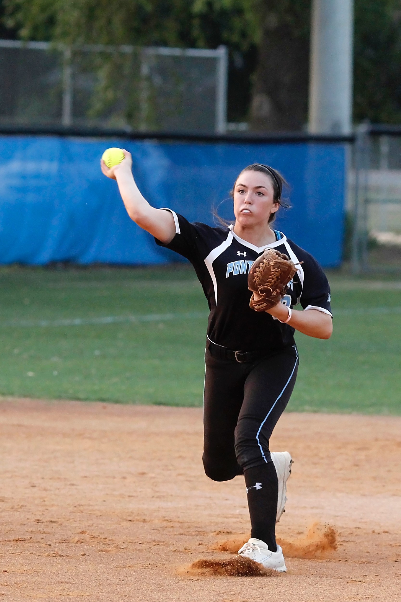 Shark shortstop Michelle Leone throws to first get the Ridgeview batter.