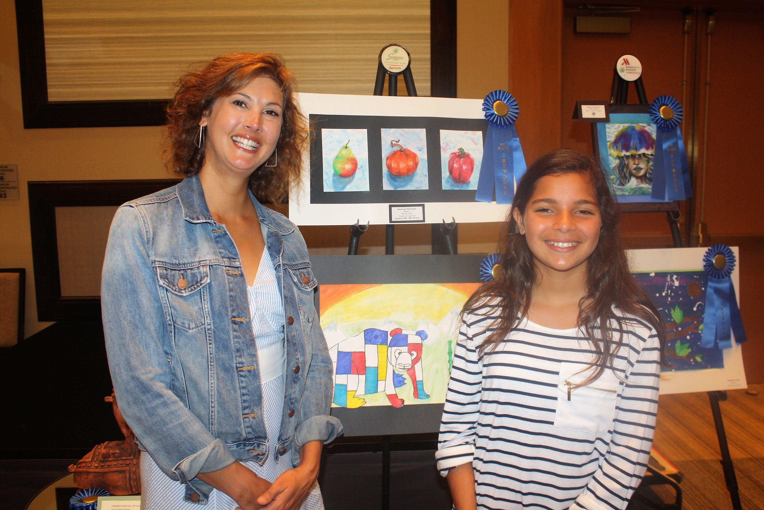 Art teacher Lauren Bayliss with student Achsah Siqueira in front of her prize winning artwork (bottom)