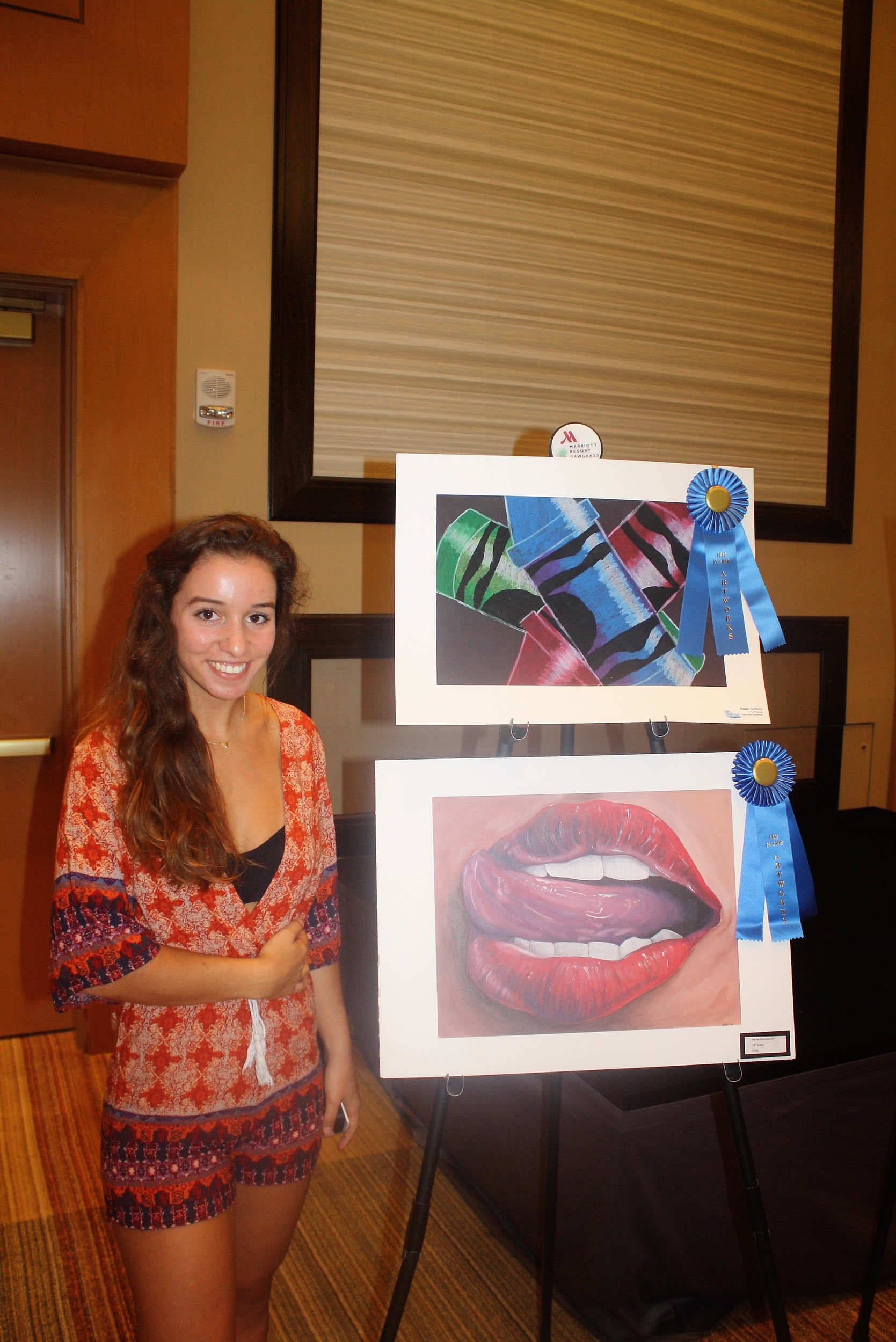 Ponte Vedra High School student Rachel Dornstuader displays her prizewinning artwork (bottom)