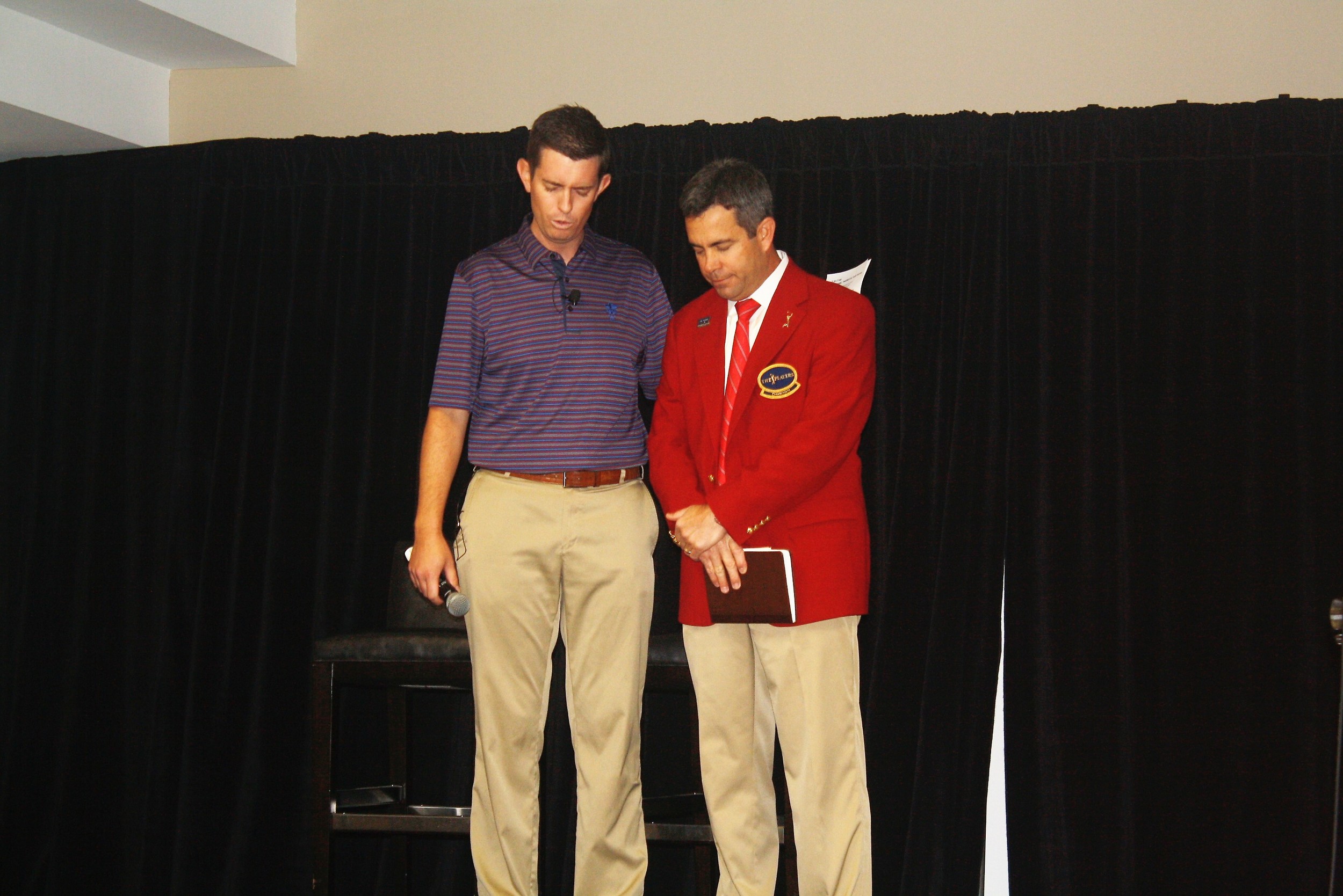 Matt Roop leads guests in prayer for Tournament Chairman Kevin English and THE PLAYERS' 2,000 volunteers.