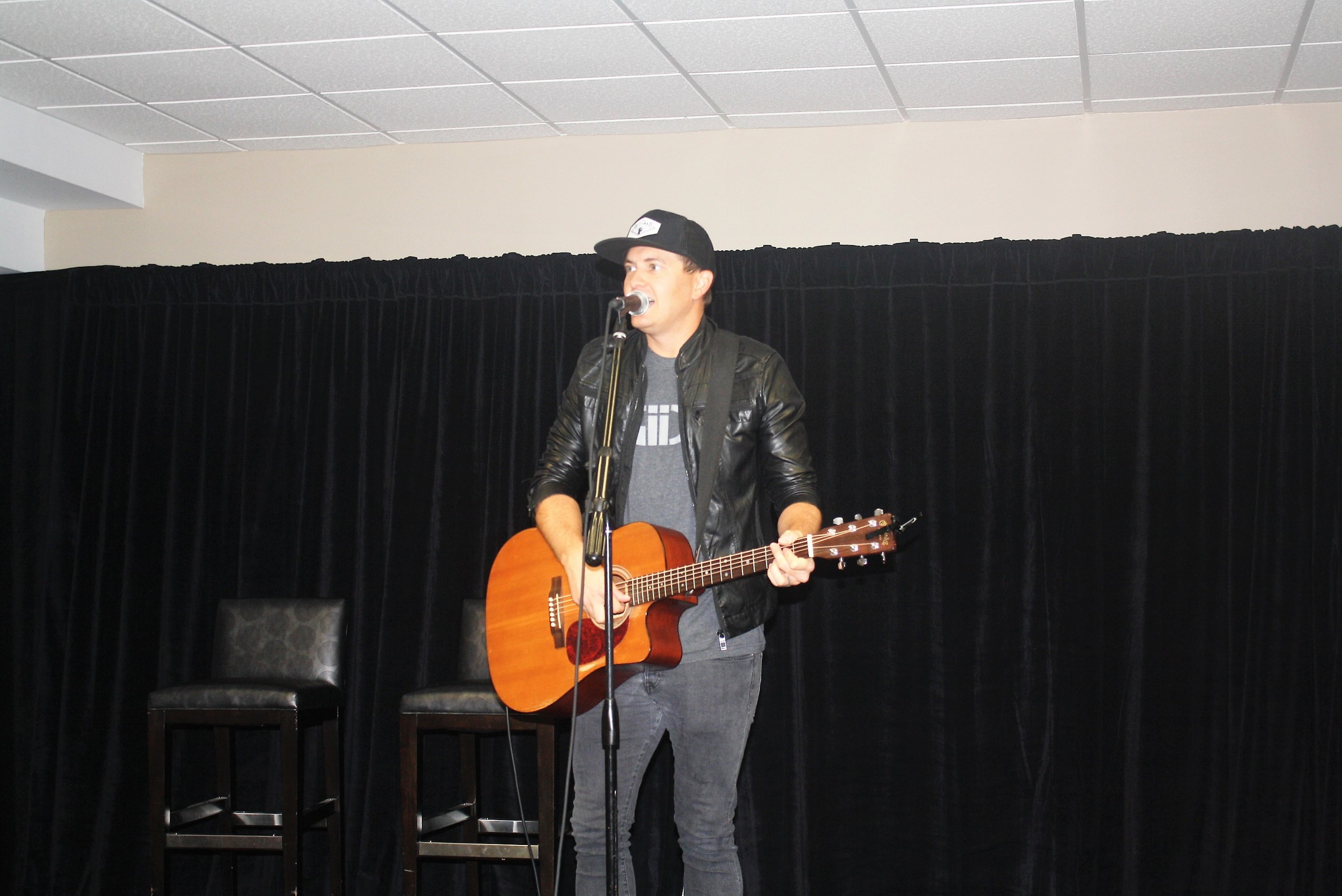 Audio Adrenaline's Adam Agee entertains youth golfers at the Breakfast with the Pros.