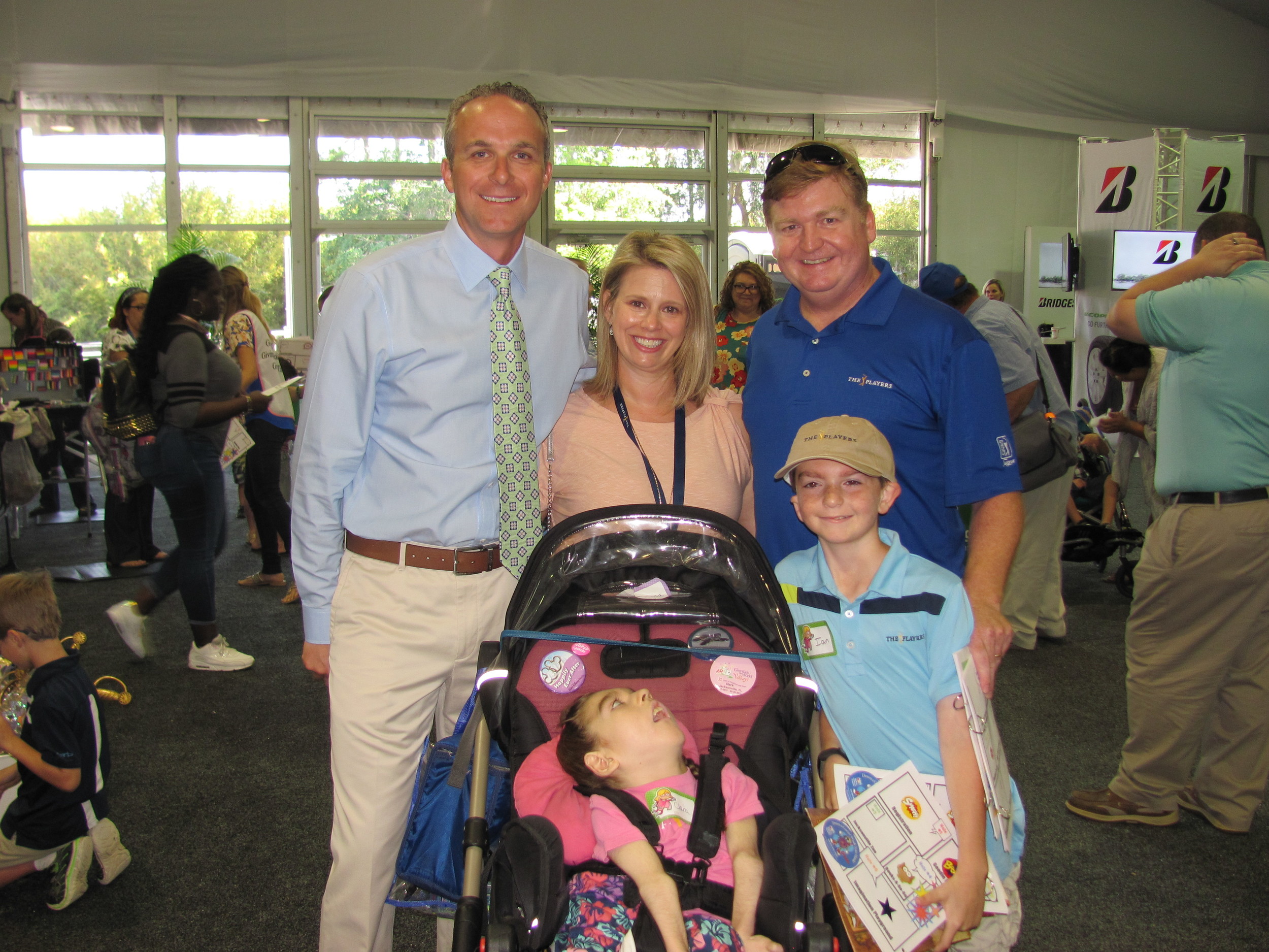 THE PLAYERS Championship Executive Director Jared Rice and his wife Sheila come together with a family from Community PedsCare at “These Kids Can Play.”