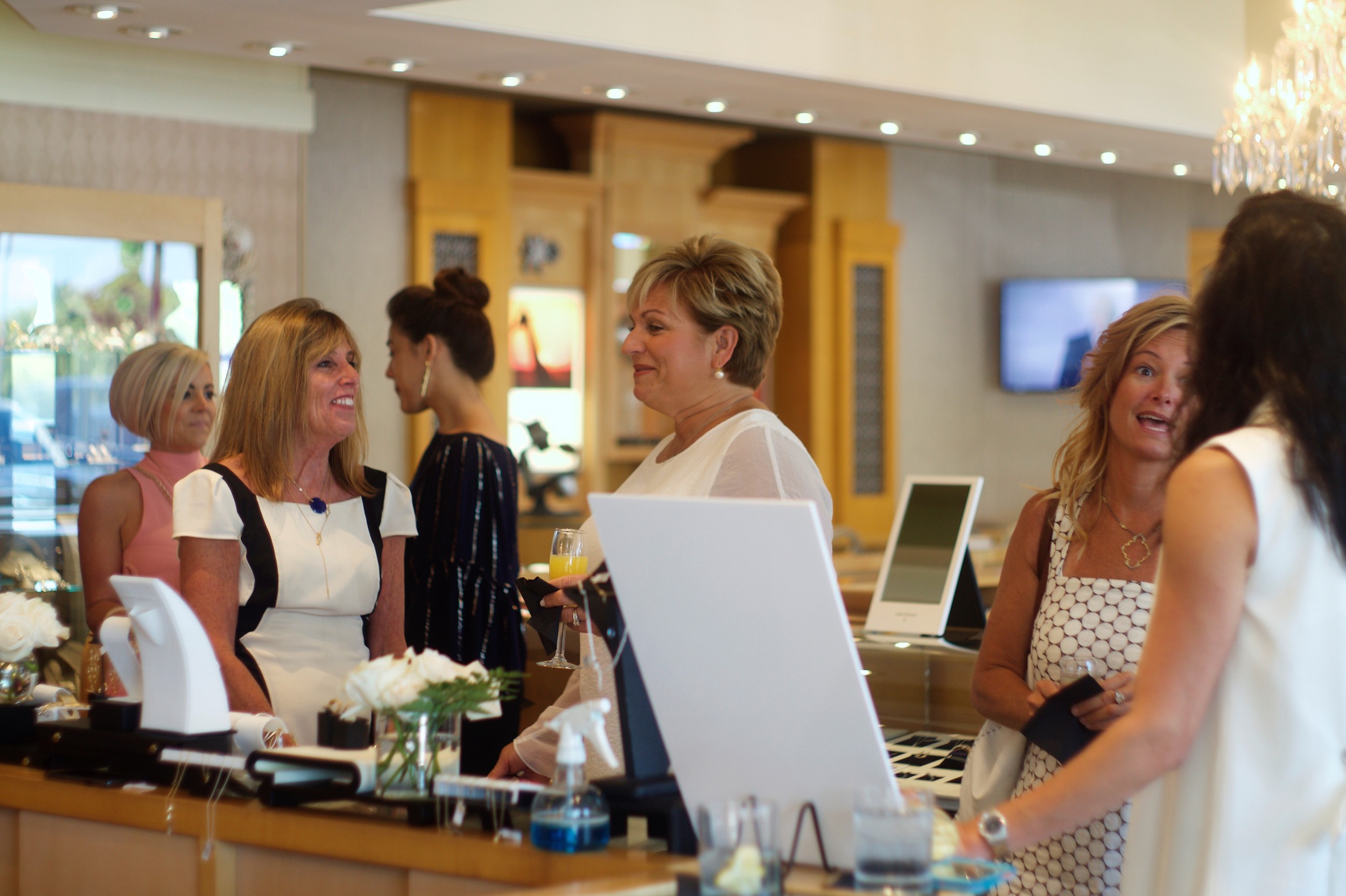 Guests mill about the store May 11 during the PGA Tour Wives Luncheon at Underwood’s Jewelers.