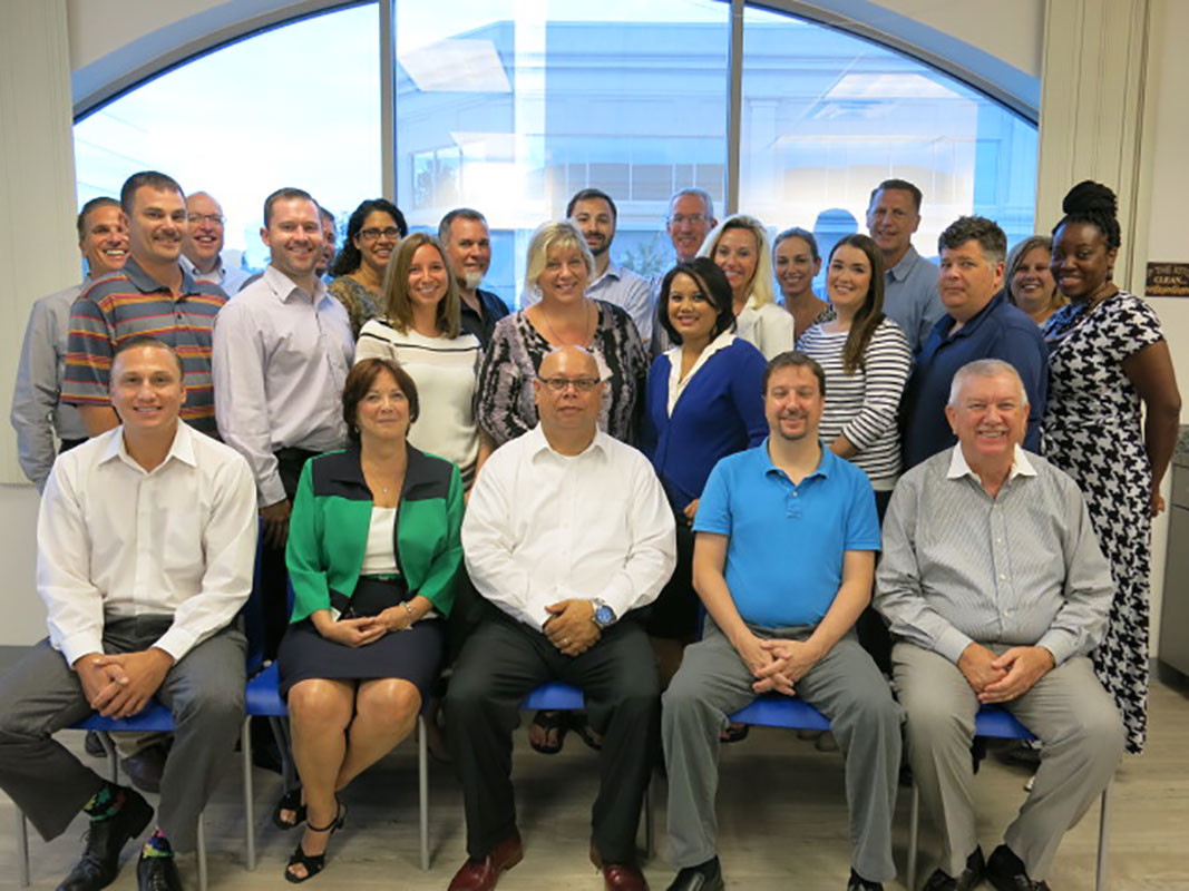 Navitas Credit Corp. employees gather for a team photo at the company’s Ponte Vedra Beach headquarters.