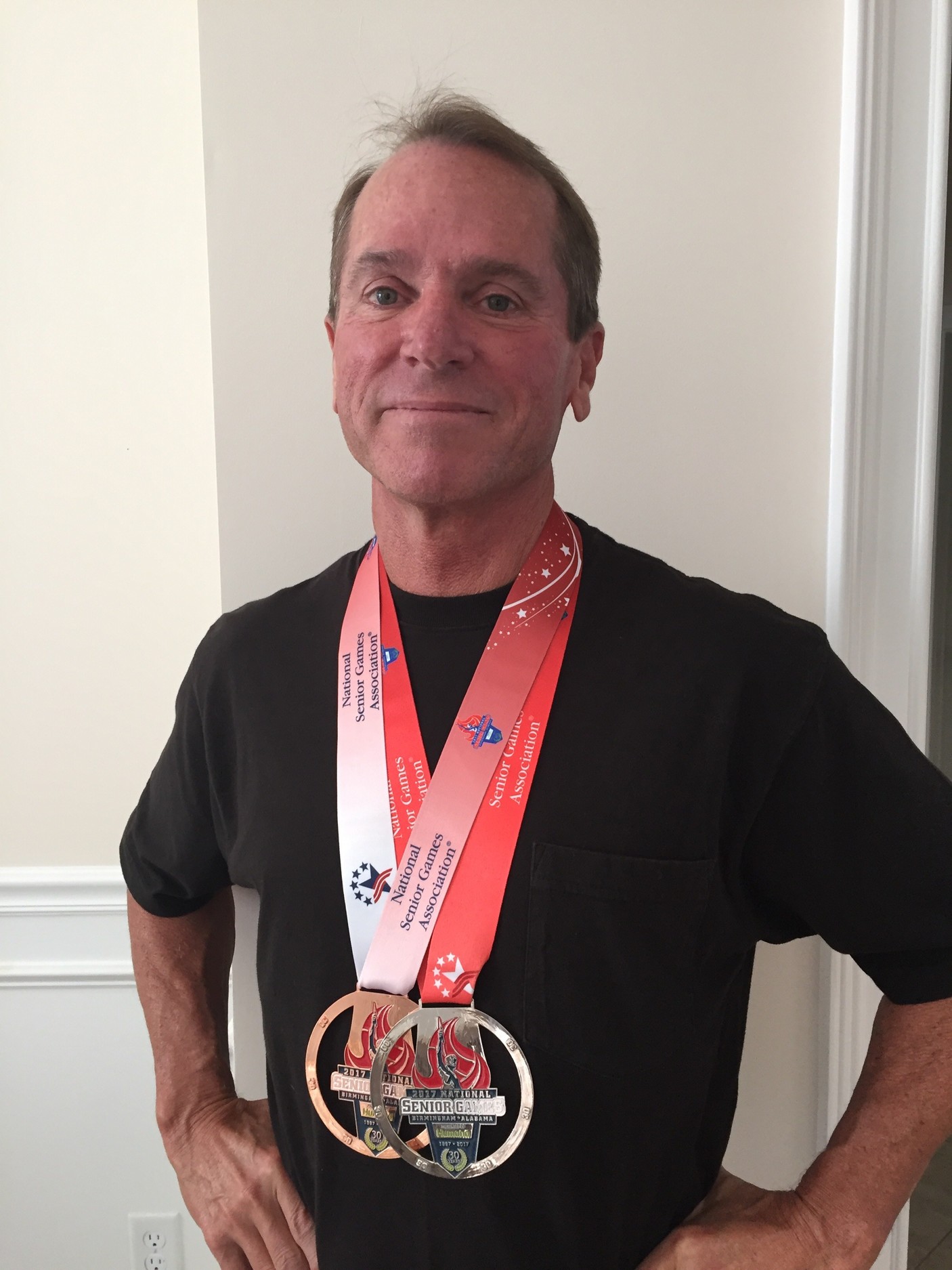 Ponte Vedra Beach swimmer Blake Stichter displays his silver and bronze medals from the National Senior Games.