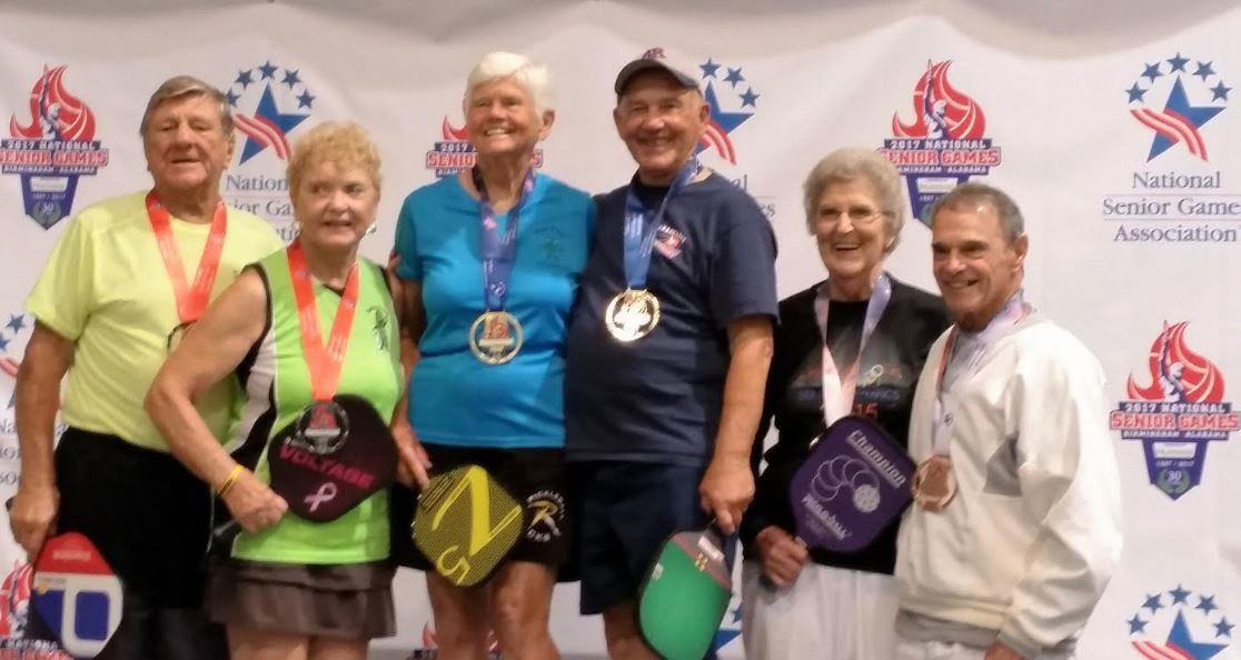 Ponte Vedra pickleball player William “Bill” Lanius (right) receives his bronze medal at the National Senior Games.