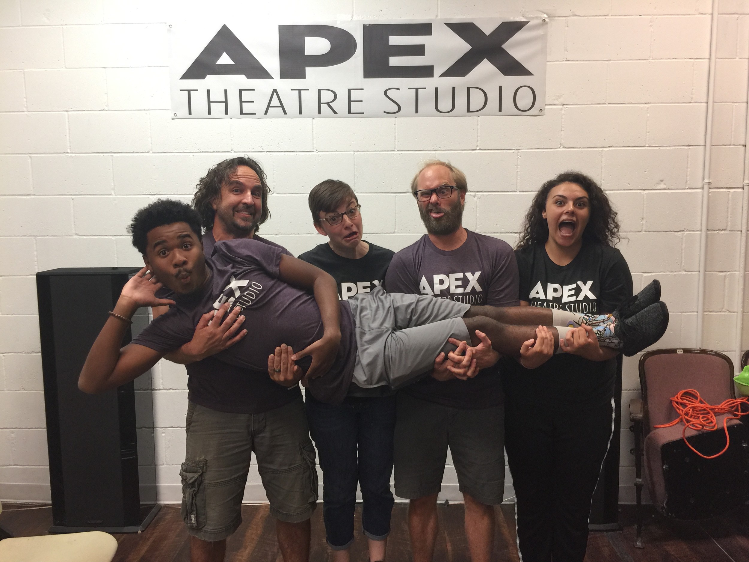 Jason Nettle, Emily Auwaerter, Robert Reid and Anita Diaz (stage manager) hold up Chase Pittman at a rehearsal for “The Complete Works of William Shakespeare Abridged.”