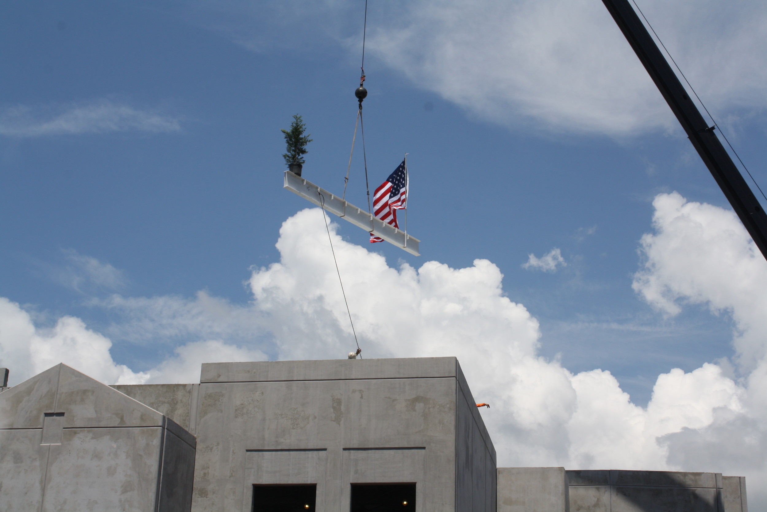 A crane lifts the final steel beam atop the new K-8 school in Nocatee at a “topping out” ceremony held last week.