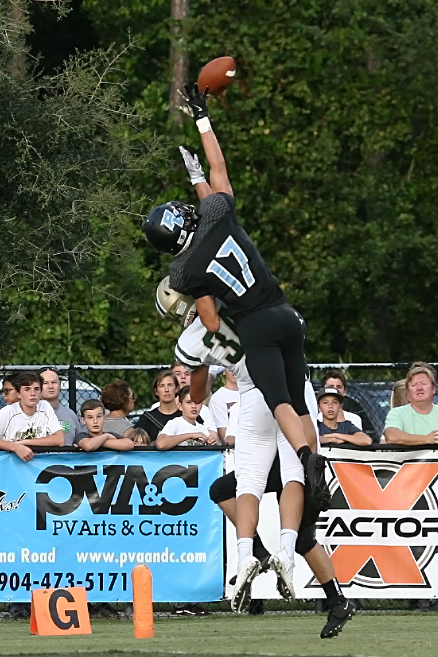 The Sharks Tommy Zitiello (#17) goes high to defend a Panther pass.
