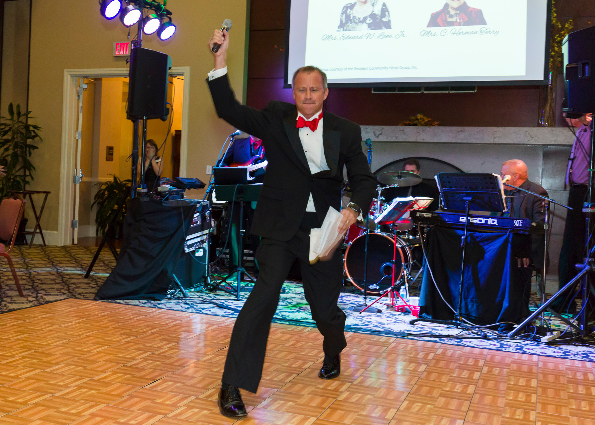 2016 Red Shield Ball Emcee and Salvation Army former Board Chair Mike Buresh throws the mic after announcing the results of the 2016 “Fund-A-Need.”