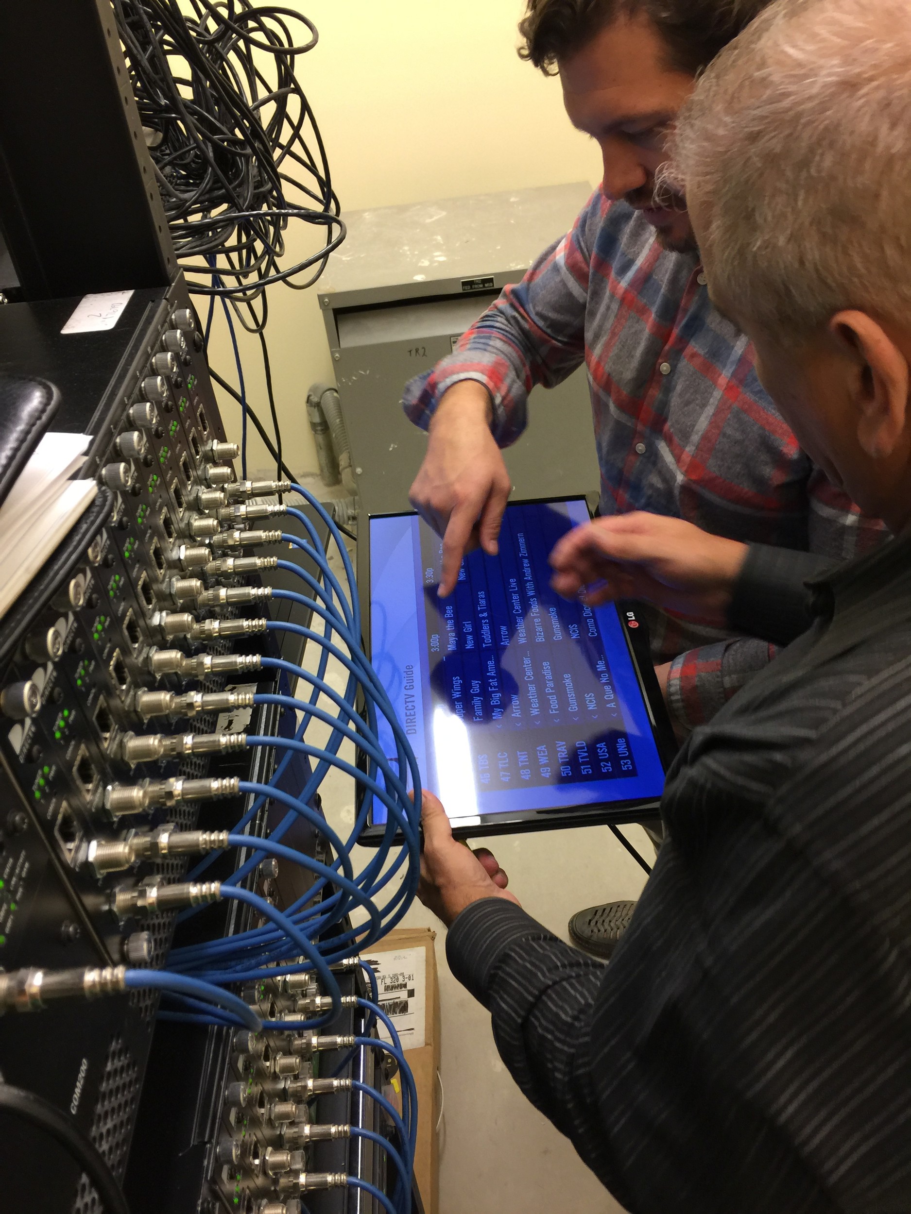MDM employees work on the DirecTV headend that was donated to Ronald McDonald House in Jacksonville.
