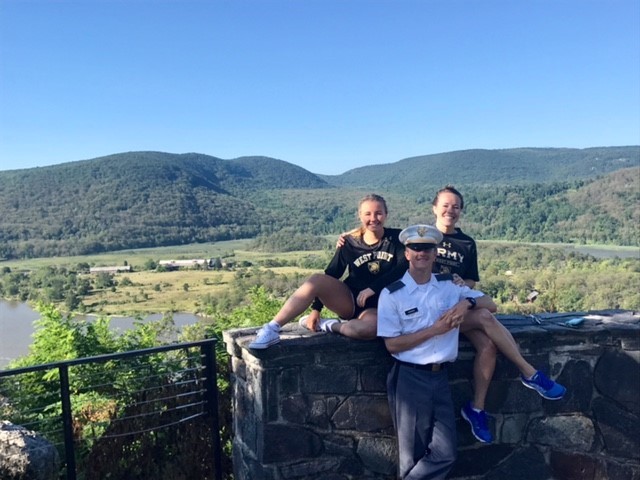 Cadet Ungrady poses with his sisters at West Point.