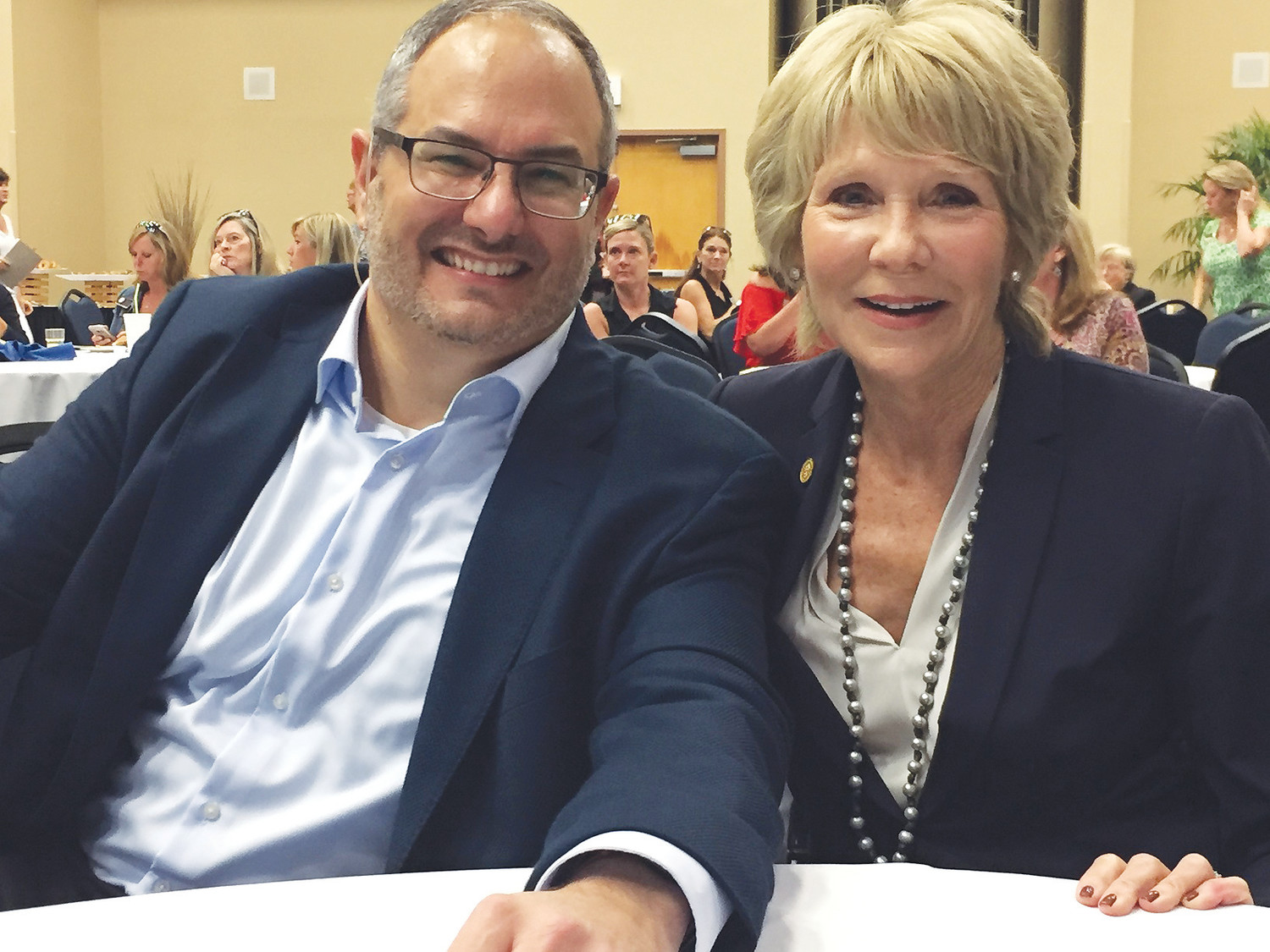 Speaker Matthew Ferrara poses with Berkshire Hathaway HomeServices Florida Network Realty Founder, President and CEO Linda Sherrer during a writing workshop hosted by the realty company.