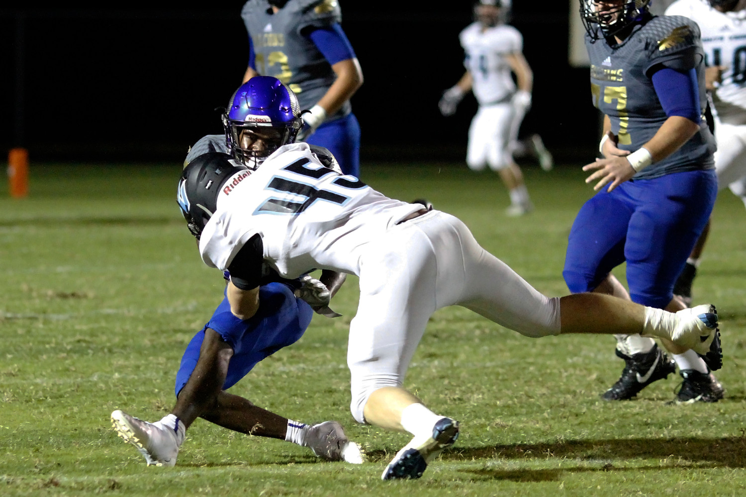 CD James of Ponte Vedra fights off a stiff arm to the face.