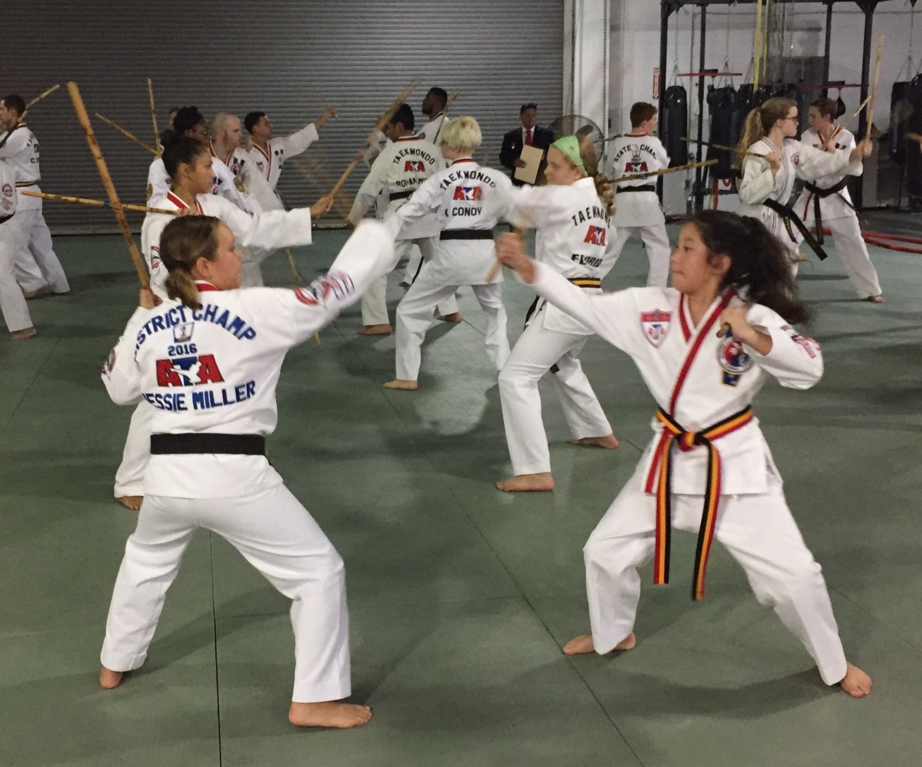 Jessie Miller (left) and Lilly Sonn work on their karate moves.