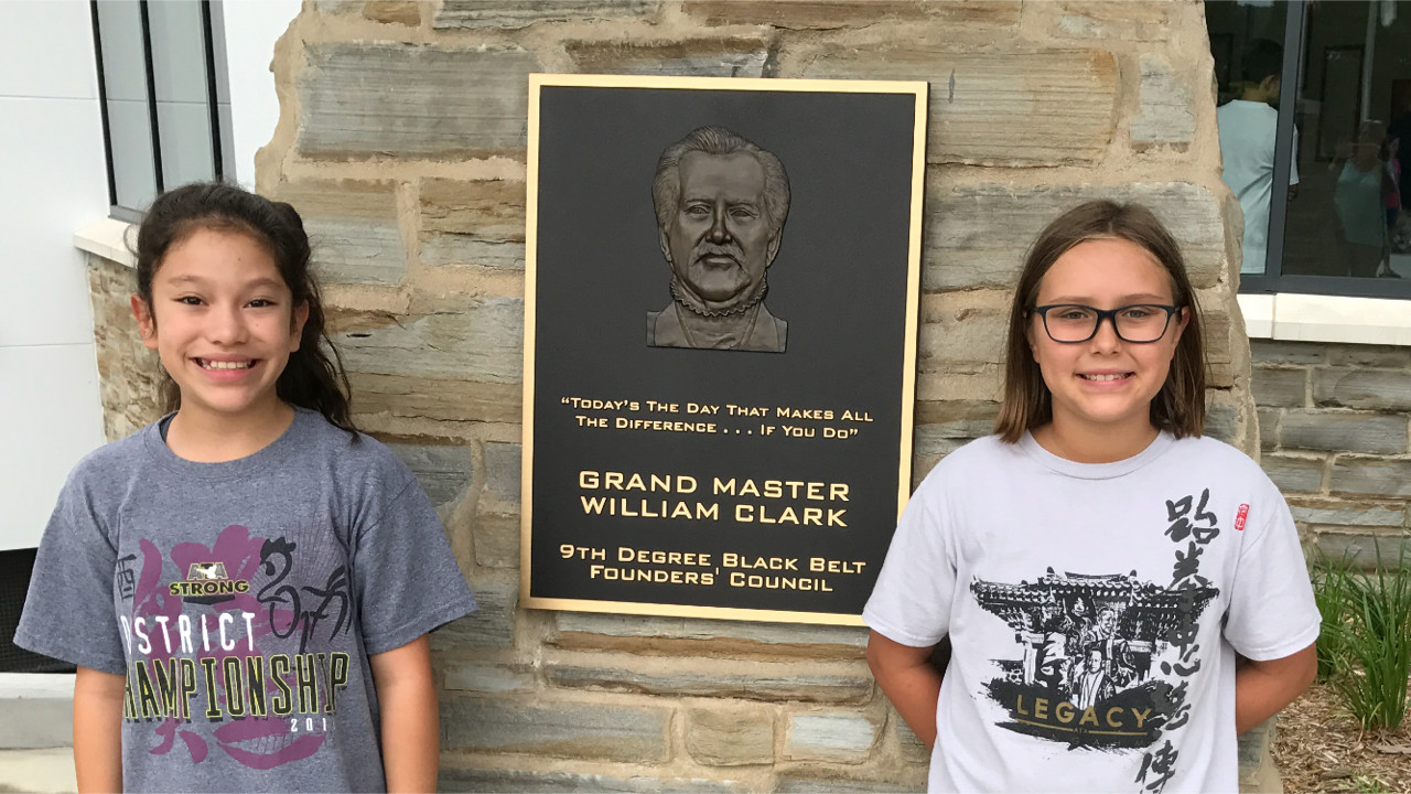 Lilly Sonn (left) and Jessie Miller excelled at testing for their karate teaching certification.