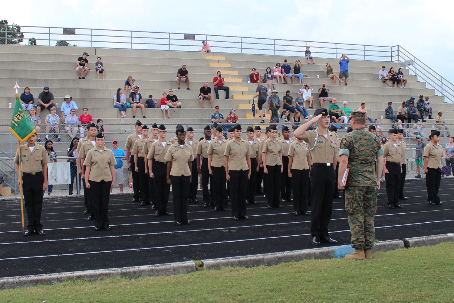 Cadet Mac Davis leads Nease NJROTC during the Personnel Inspection event as active duty Marine Corps and Navy non-commissioned officers prepare to inspect the cadets.