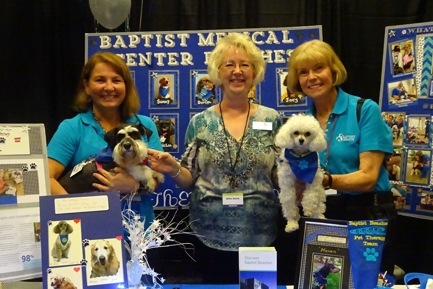 Billie Smith (center), executive director of Alliance of Therapy Dogs, conducts a workshop for people interested in getting started in pet therapy. Beaches residents Marge Gallardo (left) and Marcie Ryan volunteer with their dogs, Lulu Belle and BeBe, at Baptist Medical Center-Beaches.