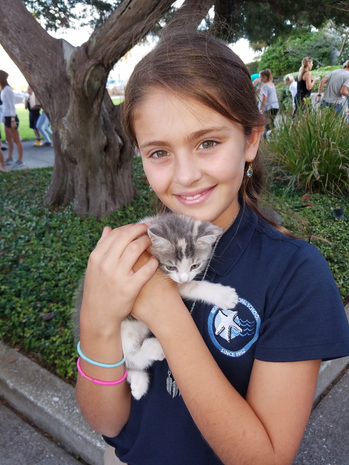 A Beaches Episcopal student holds a cat closely at “Blessing of the Pets.”