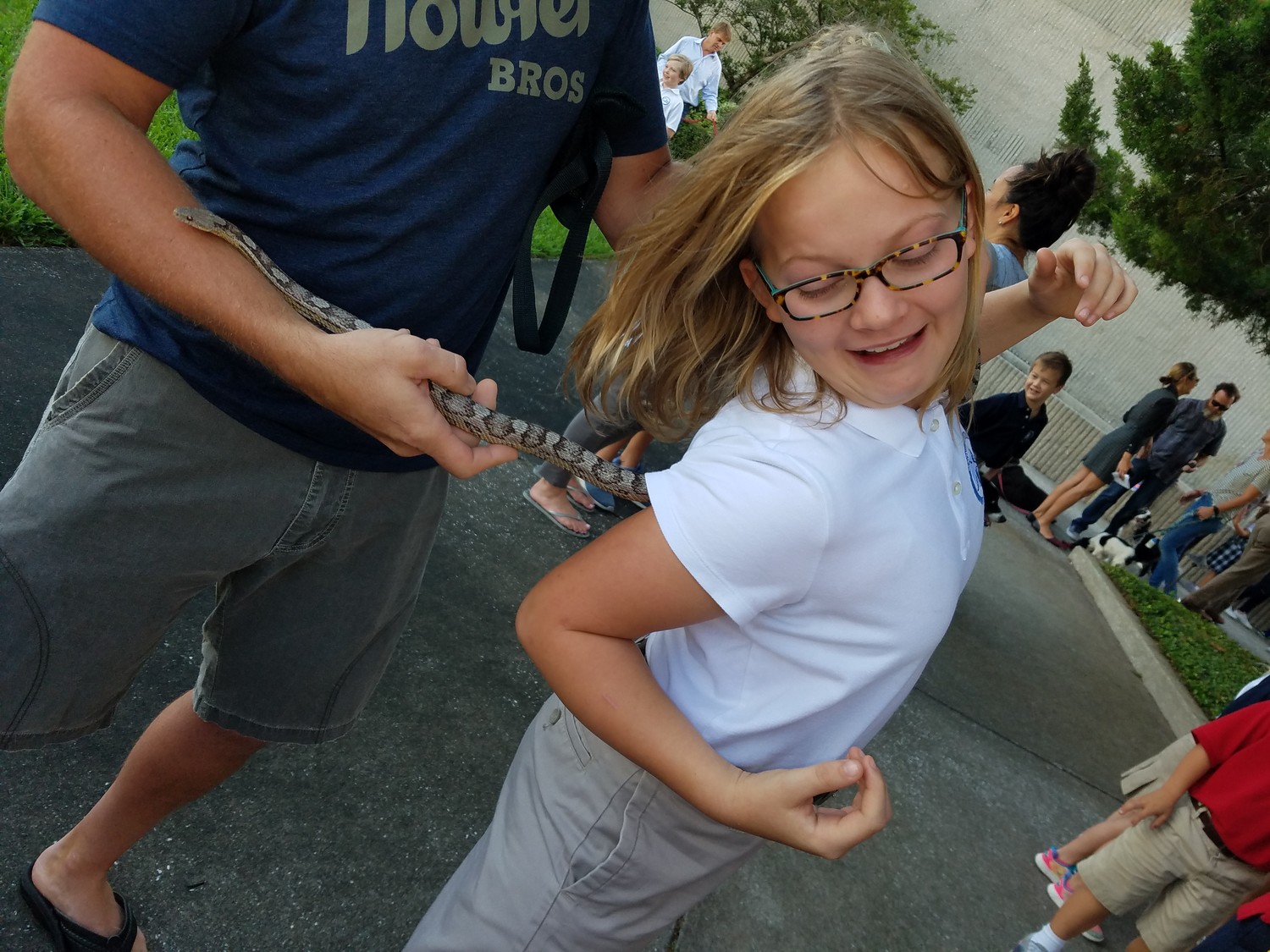 A snake comes too close for comfort for a girl at “Blessing of the Pets.”