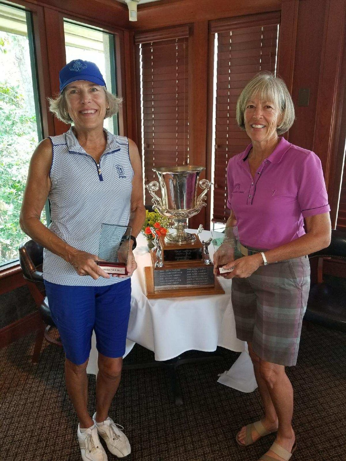 Helen Short (right) won the Marsh Landing Women’s Club Championship for the second year in a row, and Peggy Stanley (left) earned the net champion title. The gross champion of the pink tee division was Linda Doran. The tournament was held Oct. 5 and 6 at the Marsh Landing Country Club.