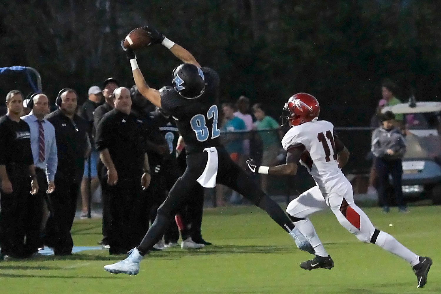 Reese Russi pulls down a pass for the Sharks against Parker.