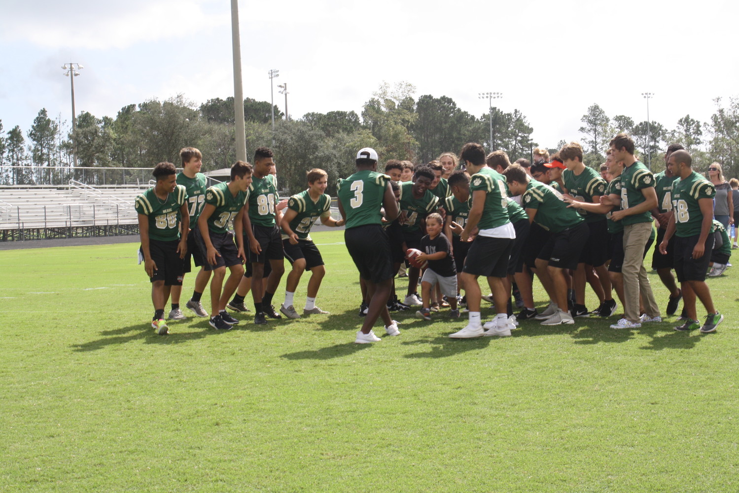 Special needs students from Valley Ridge Academy, Timberlin Creek Elementary and Wards Creek Elementary score touchdowns with the support of the Nease football team during the “Victory Day” event at Nease High School last Friday.