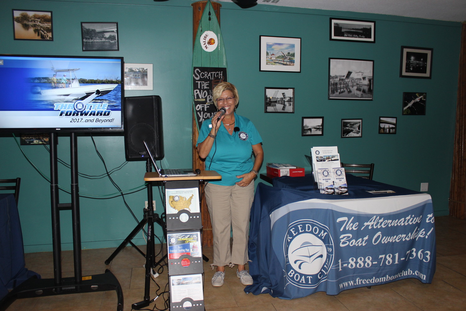 Freedom Boat Club owner Lisa Almeida addresses the crowd at the Chamber ribbon cutting event.