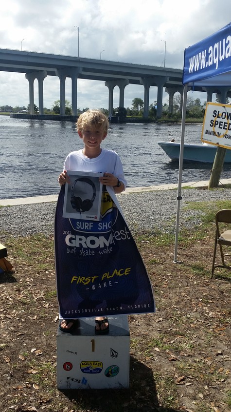 Colton Moore celebrates his first-place finish in wakeboarding (ages 9-11).