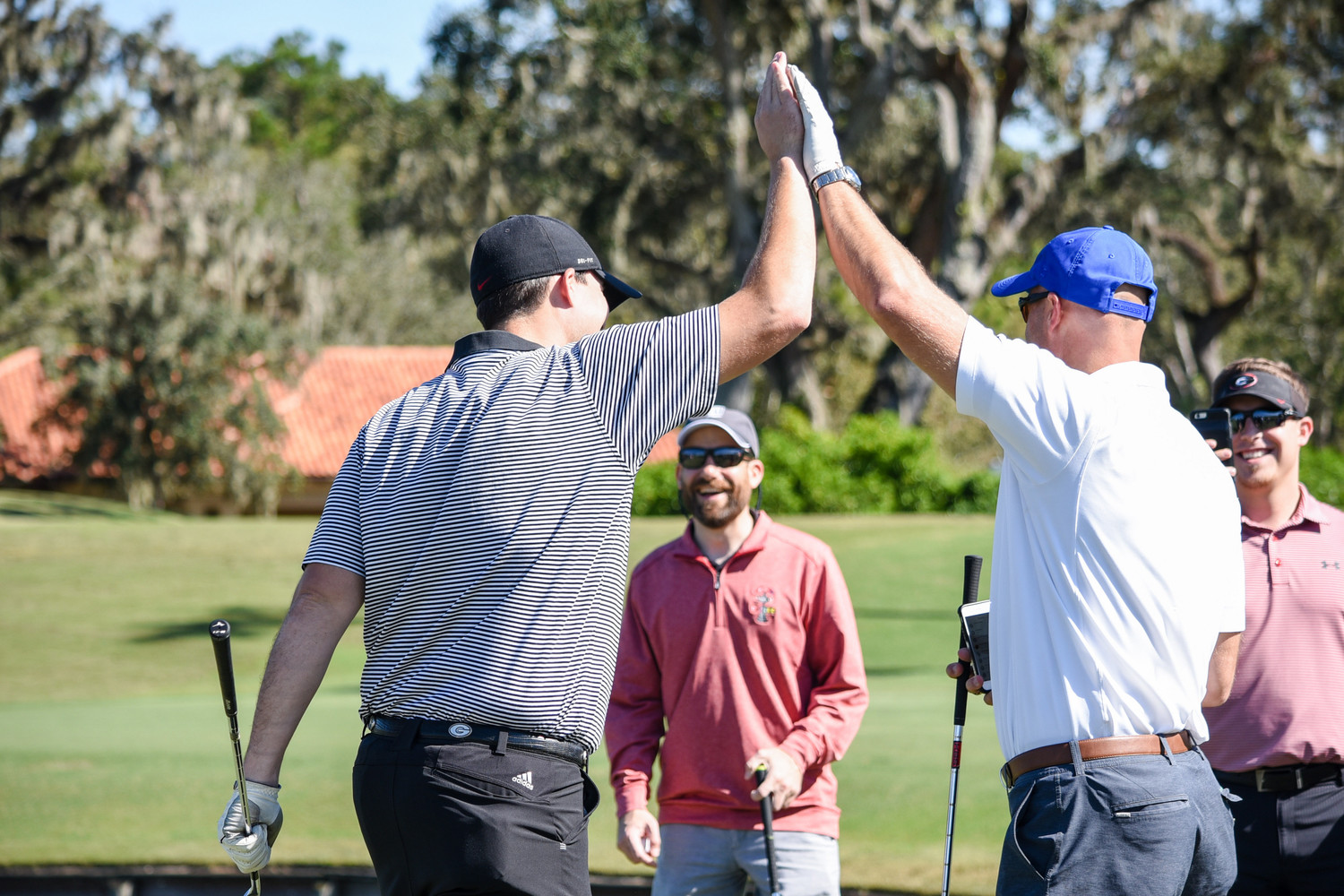 Danny Wuerffel (right) celebrates his team’s success during the Desire Cup.