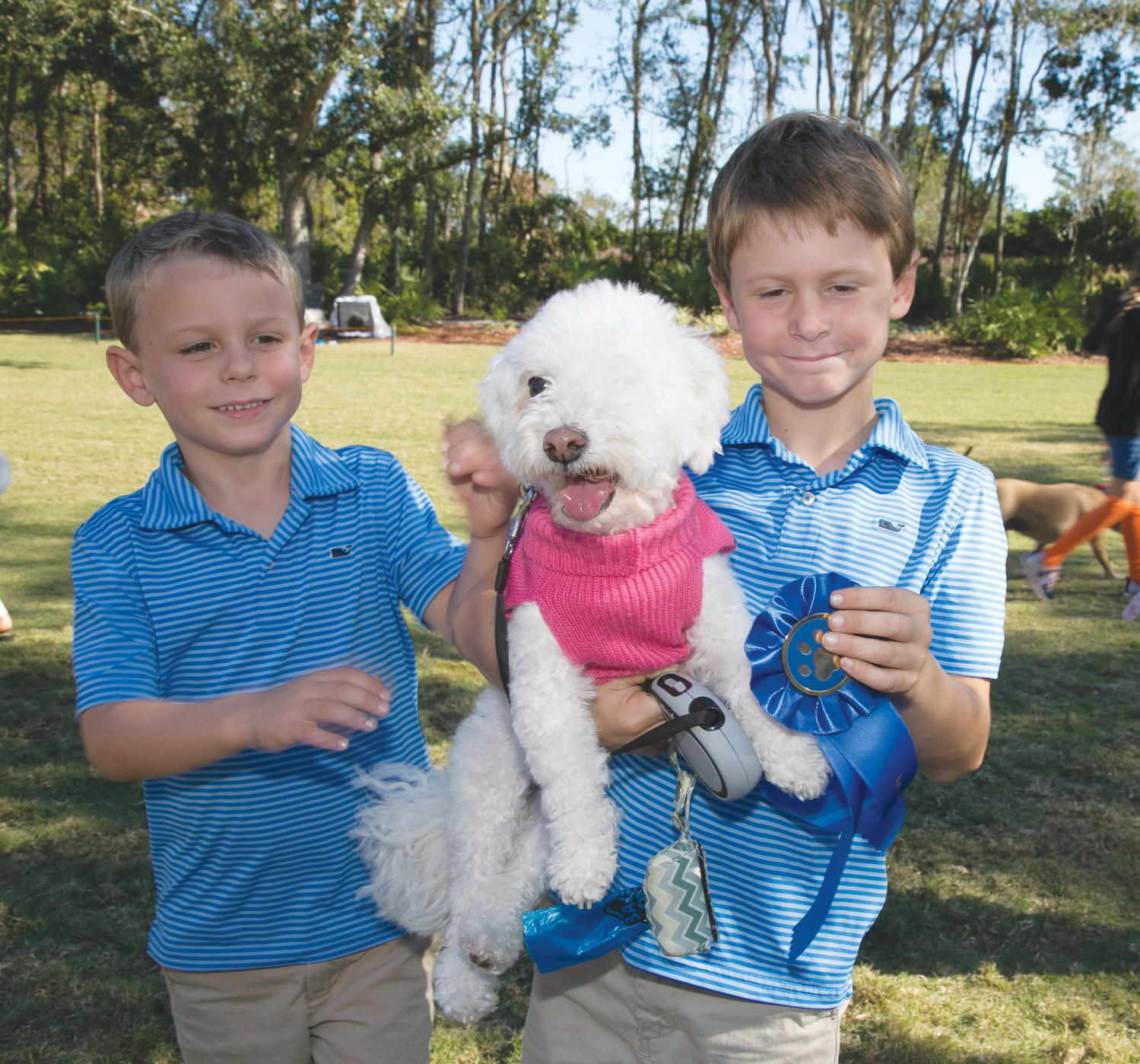 Knox, Memphis and Nash Cartwright enjoy Bark in the Park at the Plantation at Ponte Vedra Beach Nov. 4. The event benefited the Plantation Foundation, a scholarship fund for employees and dependents of employees. The day included a dog agility demonstration, a friendly dog show, a photo booth for pets, a mobile pet Groomer, a SAFE pet rescue van, music, refreshments and a raffle to benefit the Plantation Foundation.
