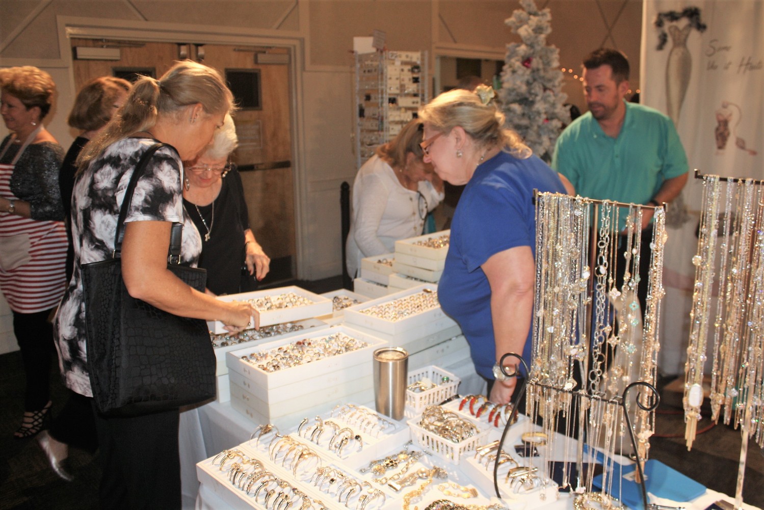 Customers look over the wares at Kathy's Accessories.