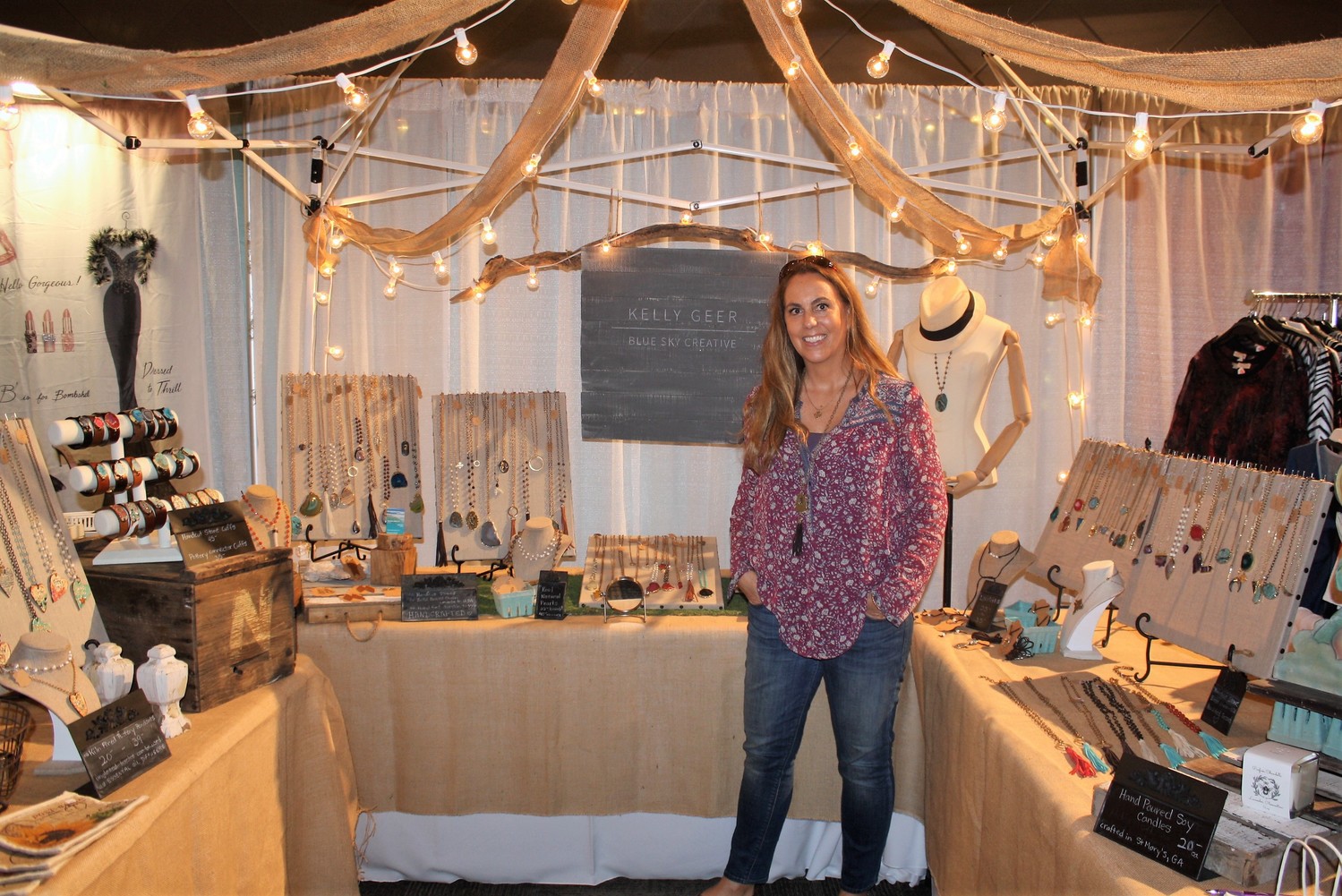 Kelly Geer of Blue Sky Creative stands with her handcrafted jewelry.