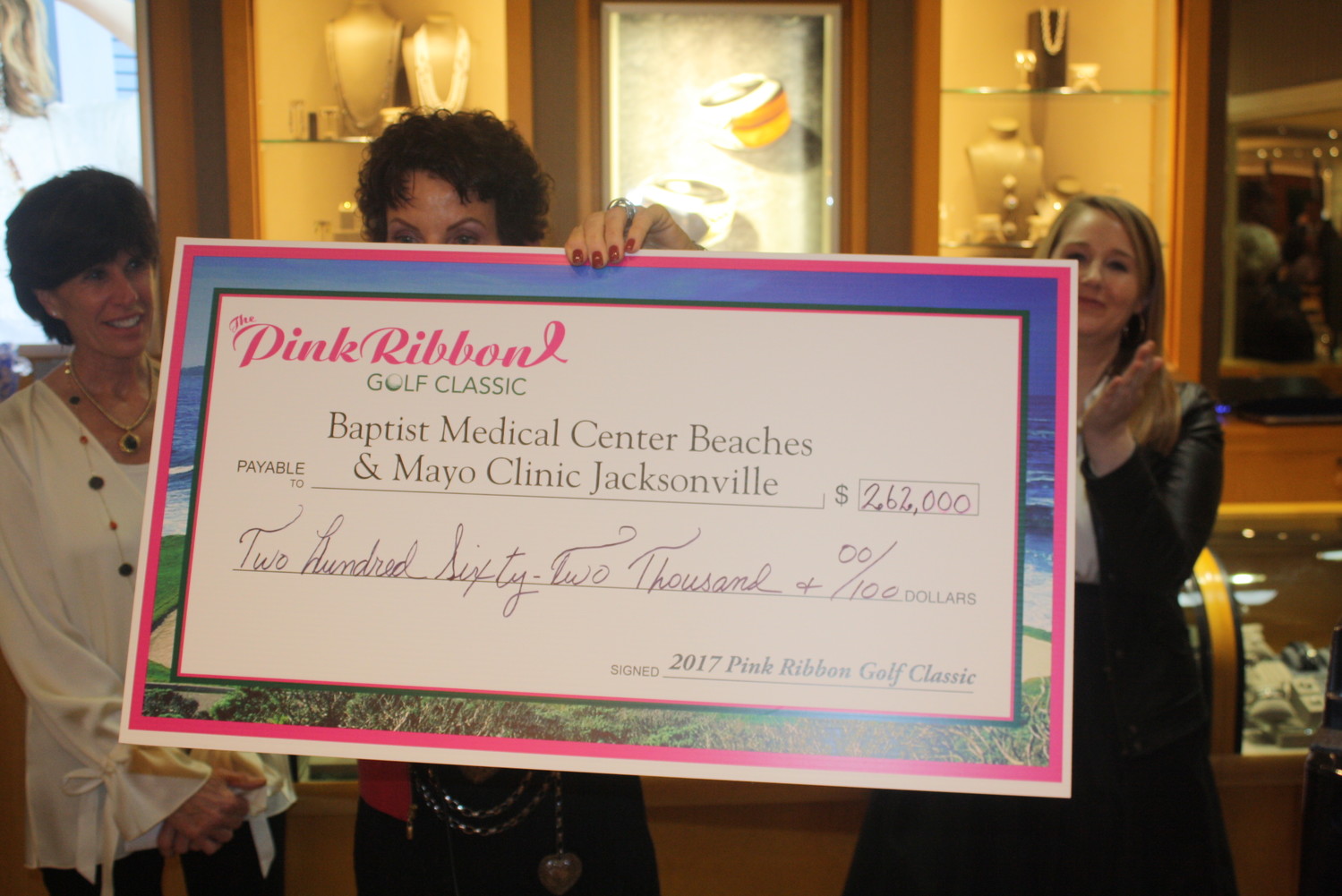 Pink Ribbon co-chair Nancy Morrison displays the check total of $262,000.