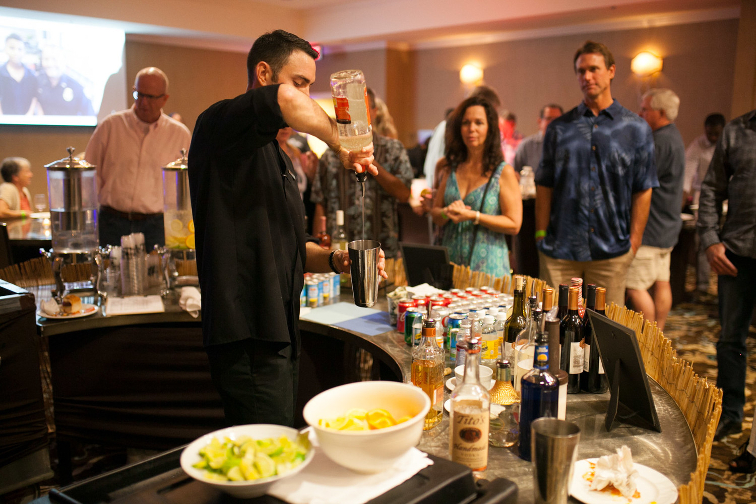 A bartender serves up one of the event's signature drinks.