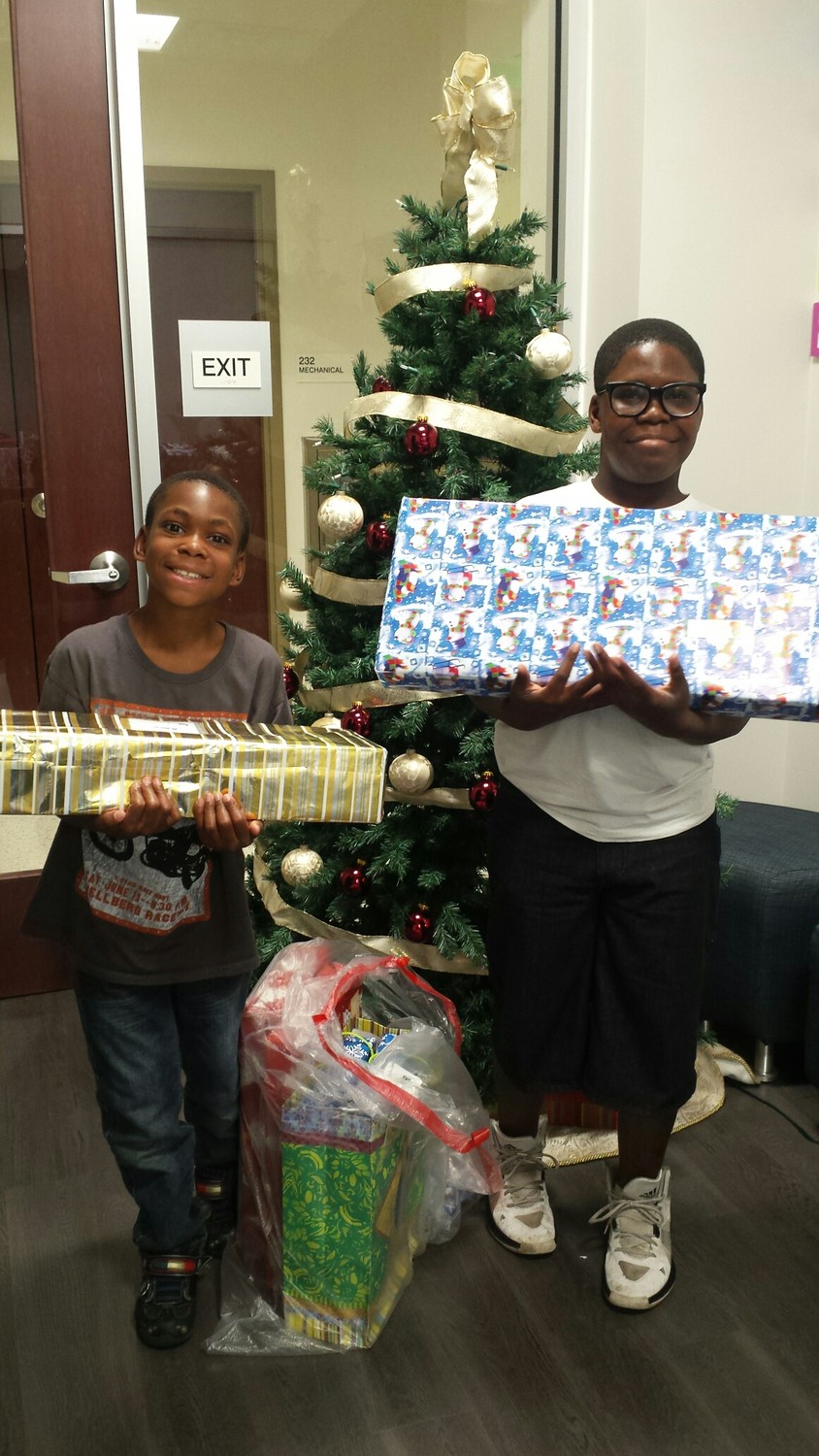 Big Brothers Big Sisters of Northeast Florida students receive gifts provided by community supporters.